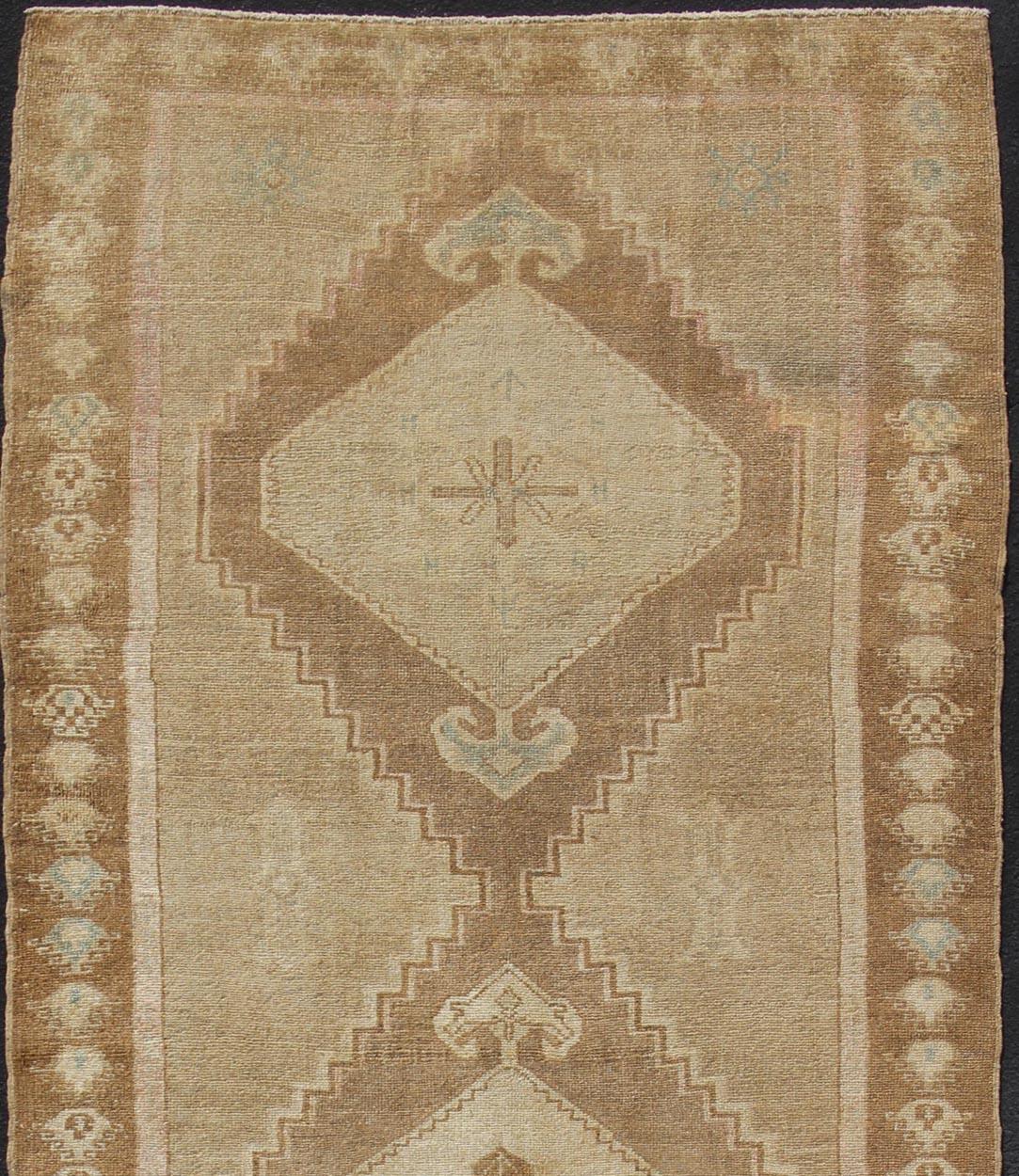 Vintage wide Gallery runner from Turkey with Medallion design in various tones of tan, sand, taupe and light brown rug en-179015 country of origin / type: Turkey / Kars, circa 1940. Large Gallery Turkish rug in Earth tones, light brown with three