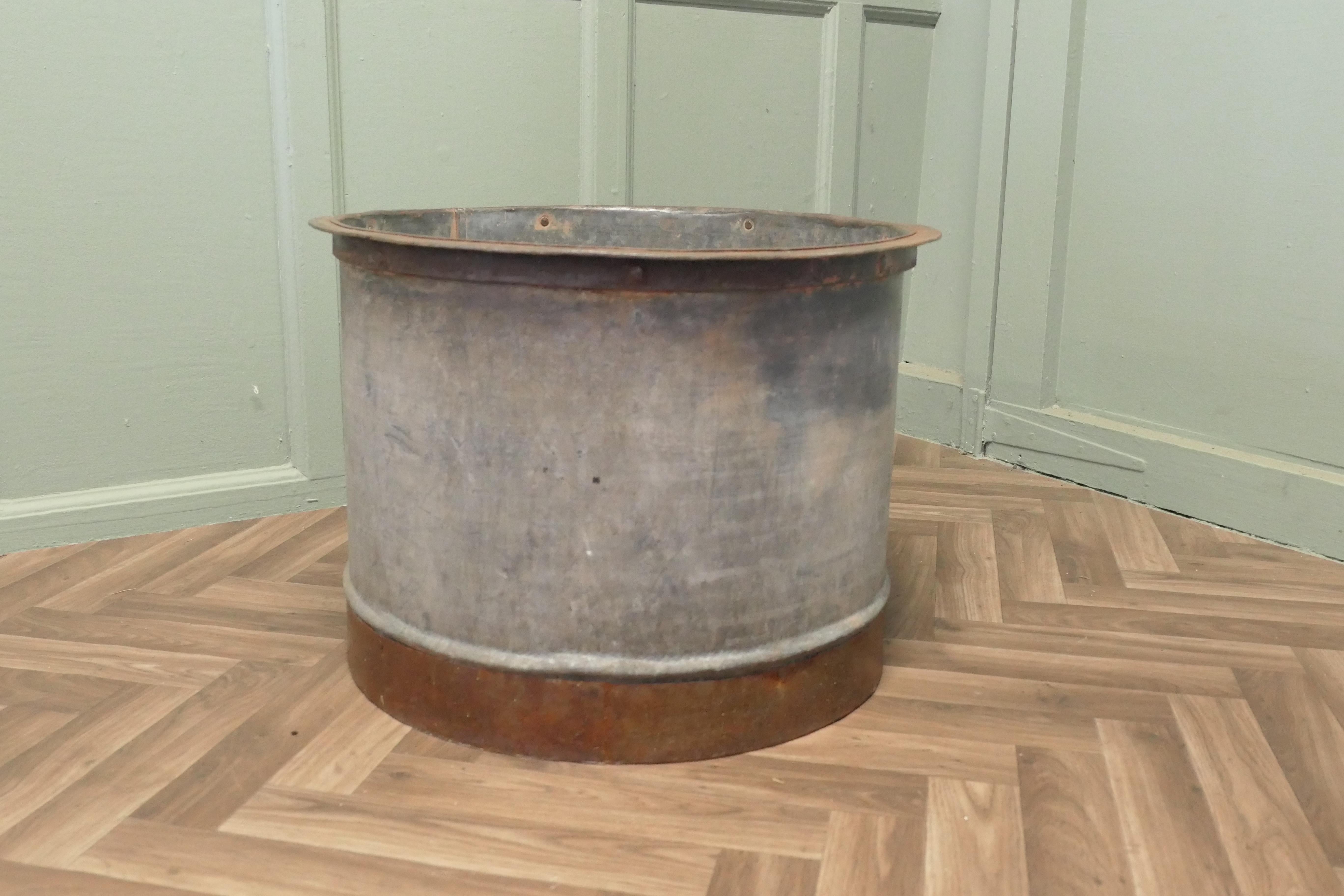 Large Galvanised Steel and Iron Cauldron Log Bin

This is a large galvanised pot it has a brutalist look with a rust covered base, this is a strong piece and it would make a great log carrier
The bucket is 15” high and 23” in diameter 
AW164
