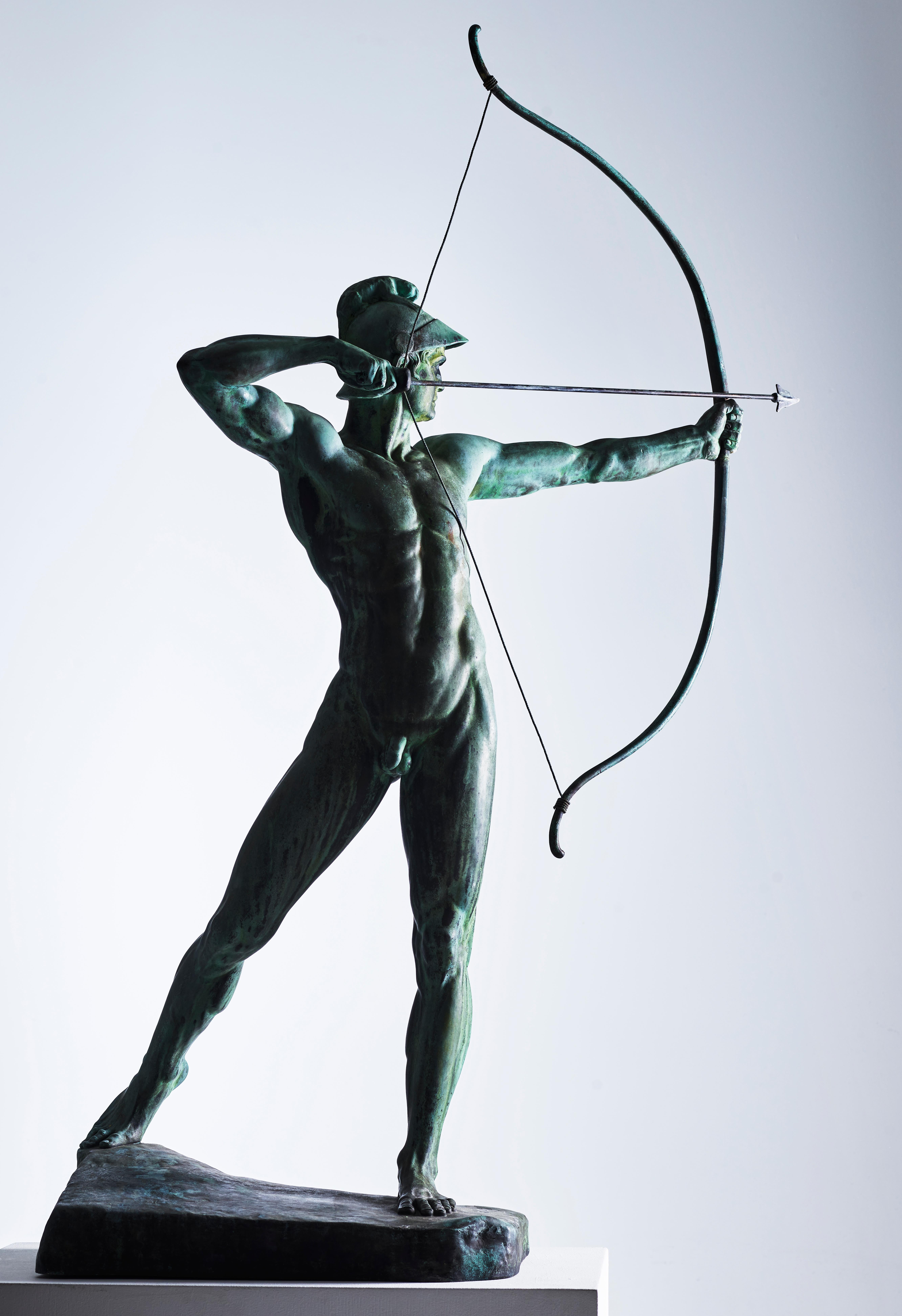 Ernst Moritz Geyger, German (1861-1941). An spectacular bronze figure of ’The Archer’, the standing naked figure wearing a helmet, drawing a bow, raised on a naturalistically cast base, signed and dated: E.M. GEYGER FEC. 

Geyger began work on the