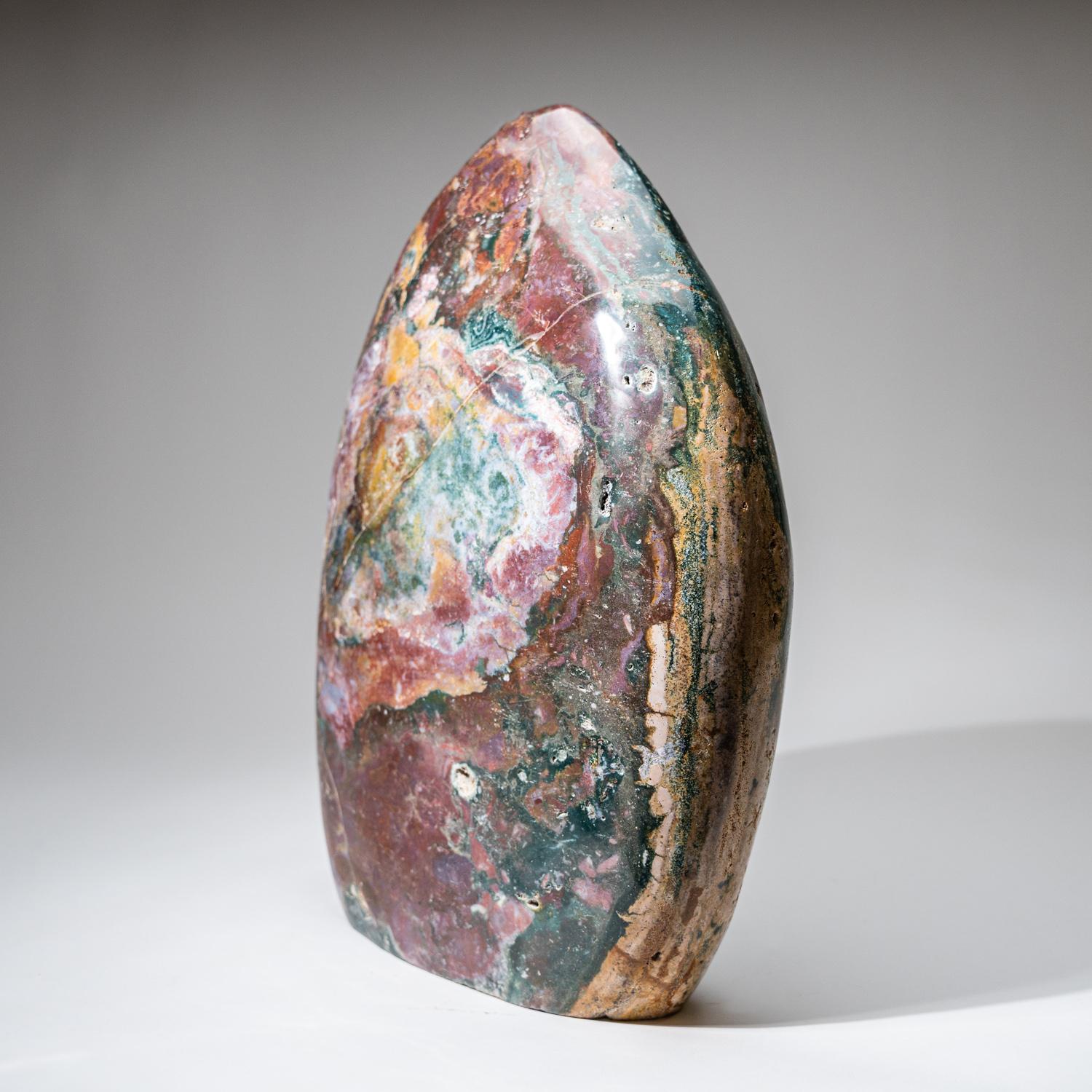 Incredible top-quality, hand-polished freeform specimen, made from a solid piece of natural Ocean Jasper. This large piece has an amazing pattern with beautiful hues of green, red, yellow, and tan. This unique specimen is the perfect accessory for