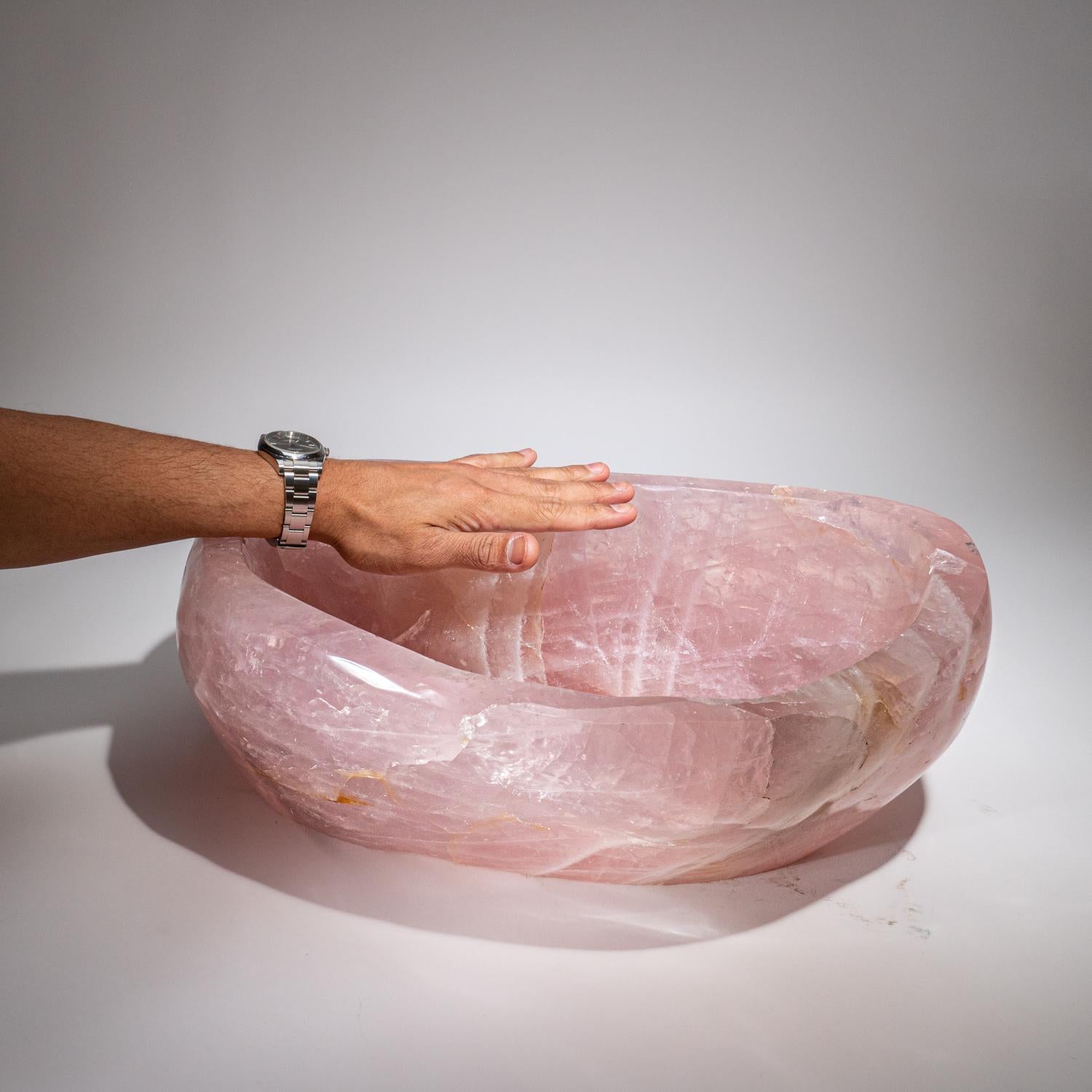 Beautiful one-of-a-kind, huge handmade polished freeform bowl made of natural Madagascan rose quartz. All sides have been hand polished to a smooth mirrored finish. This massive bowl will be a conversation piece and a beautiful centerpiece to
