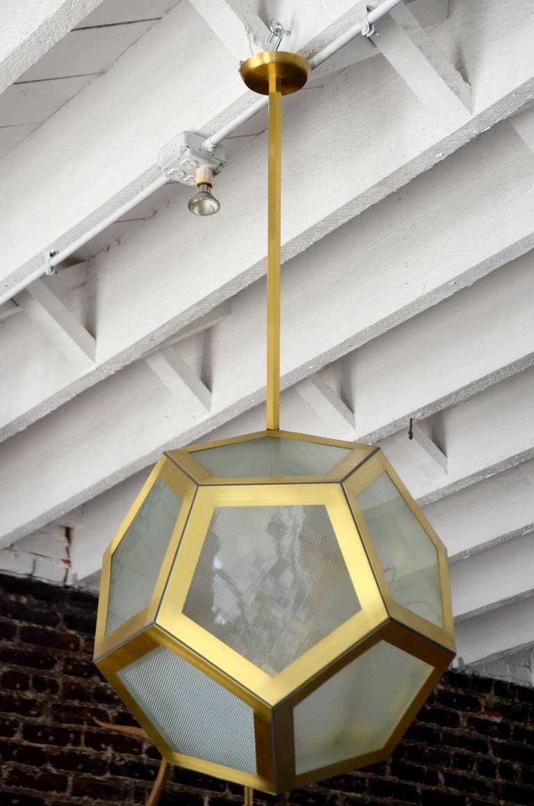 Large geometric pentagon hanging lantern, circa 1920 design.
Adjustable rod, textured glass panes, matching canopy. One pane is in fact removable for easy access to a single or double socket.