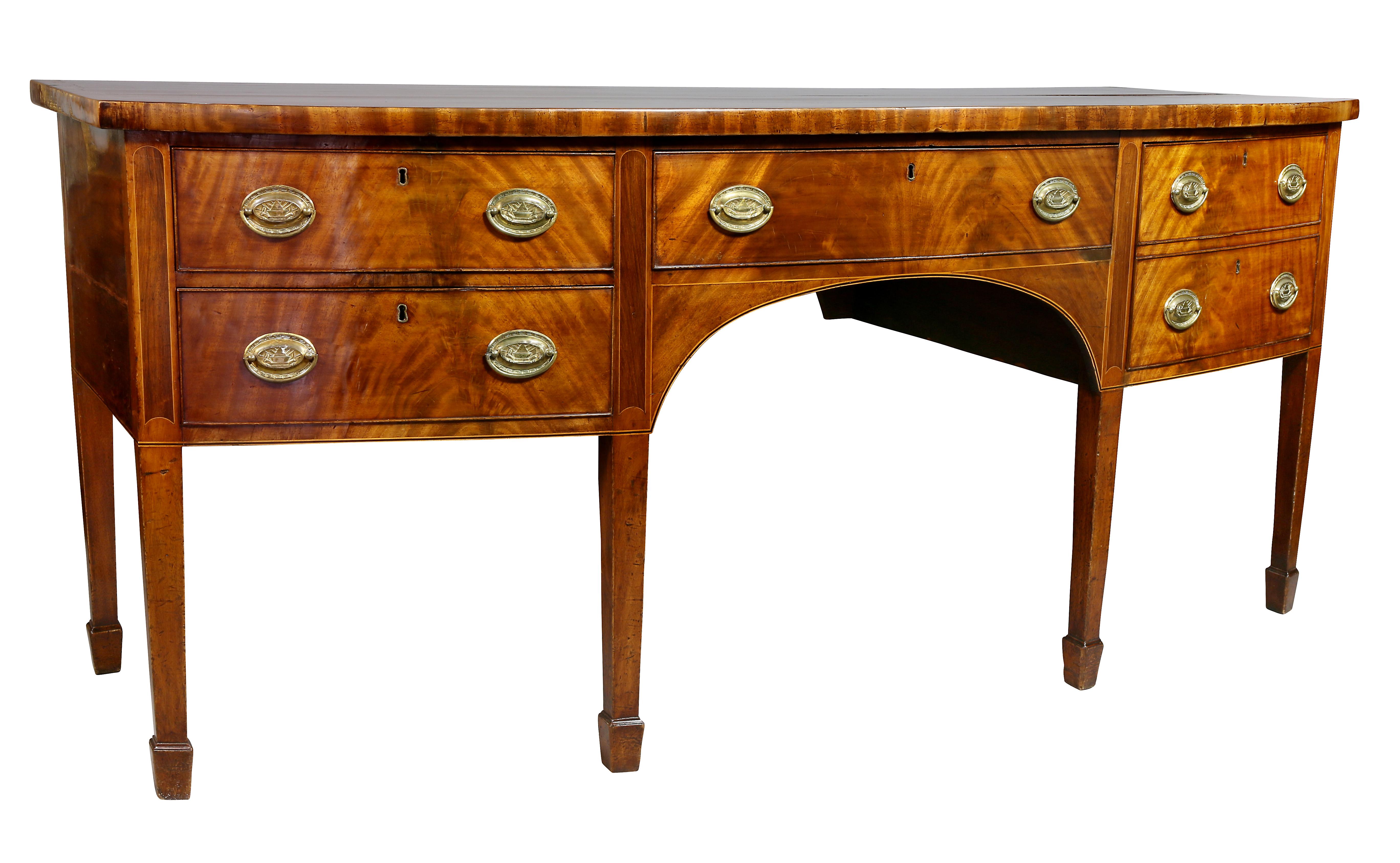 Bow front with banded edge over a central drawer flanked by a bottle drawer and two small drawers raised on square tapered legs, spade feet.