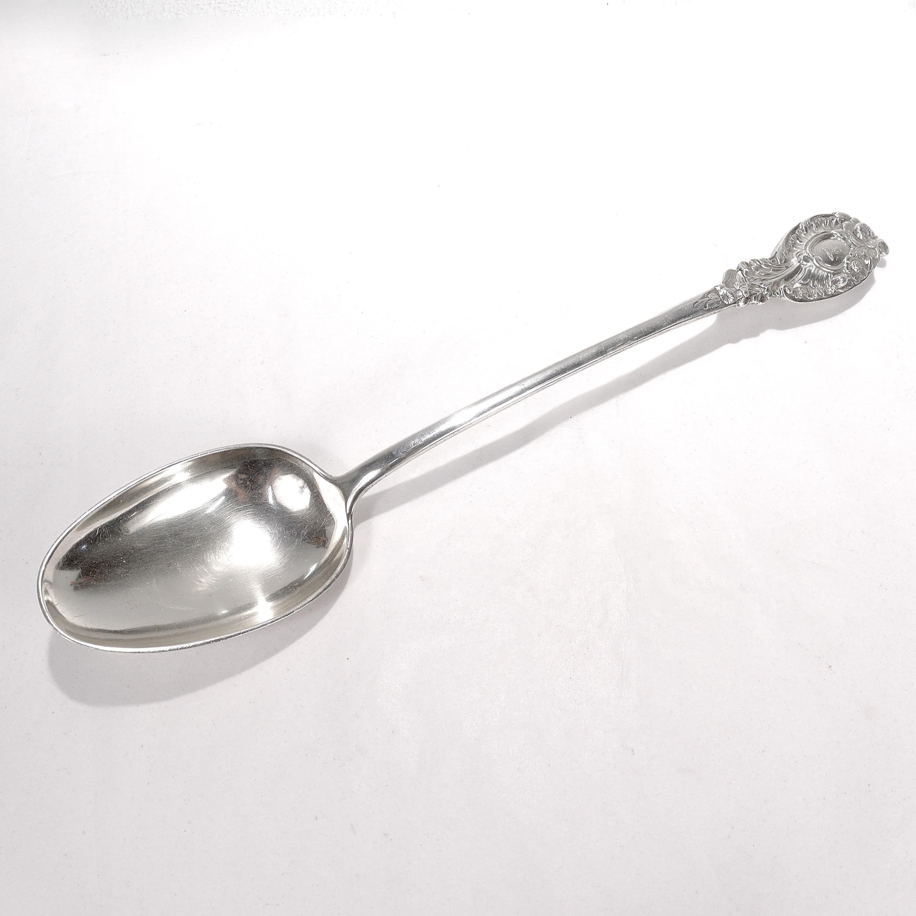 A rare, oversized antique English stuffing spoon.

In sterling silver. 

By Robert Garrard I, London, 1814.

With a rampart lion crest to the handle.

There is a seam to the handle, which we assume is original as this very large spoon was likely