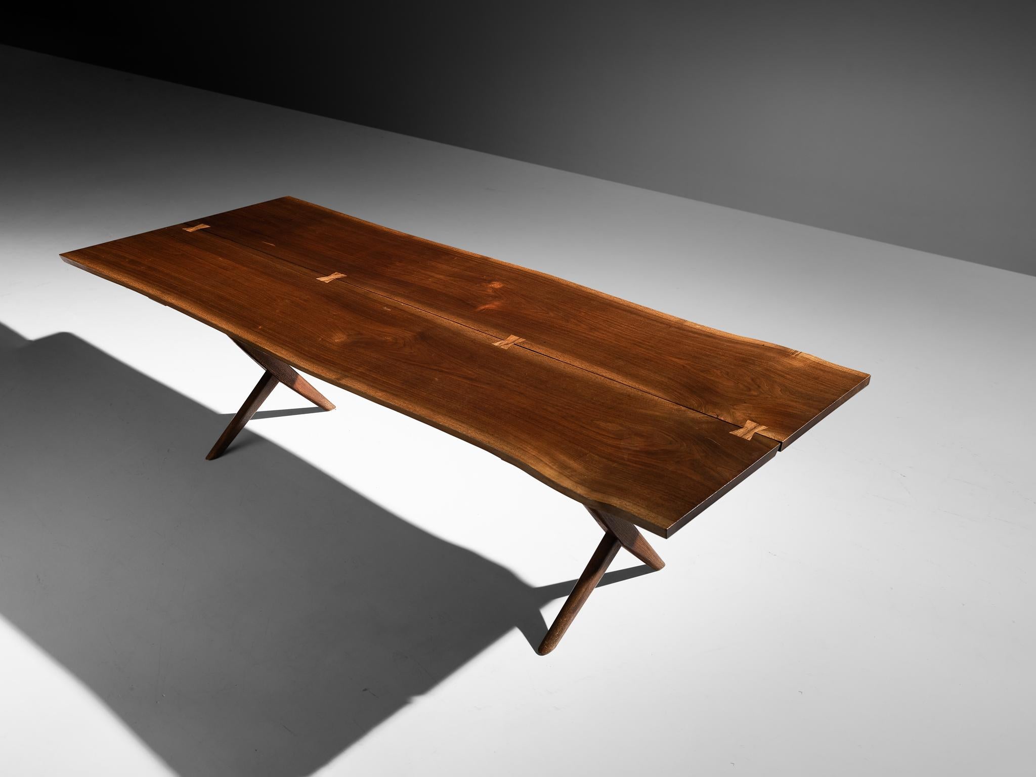George Nakashima, large free edge cross-legged dining table in American black walnut, United States, 1959. 
 
This exquisite and exceptionally large dining table was designed by George Nakashima and created in his studio in New Hope, Pennsylvania.
