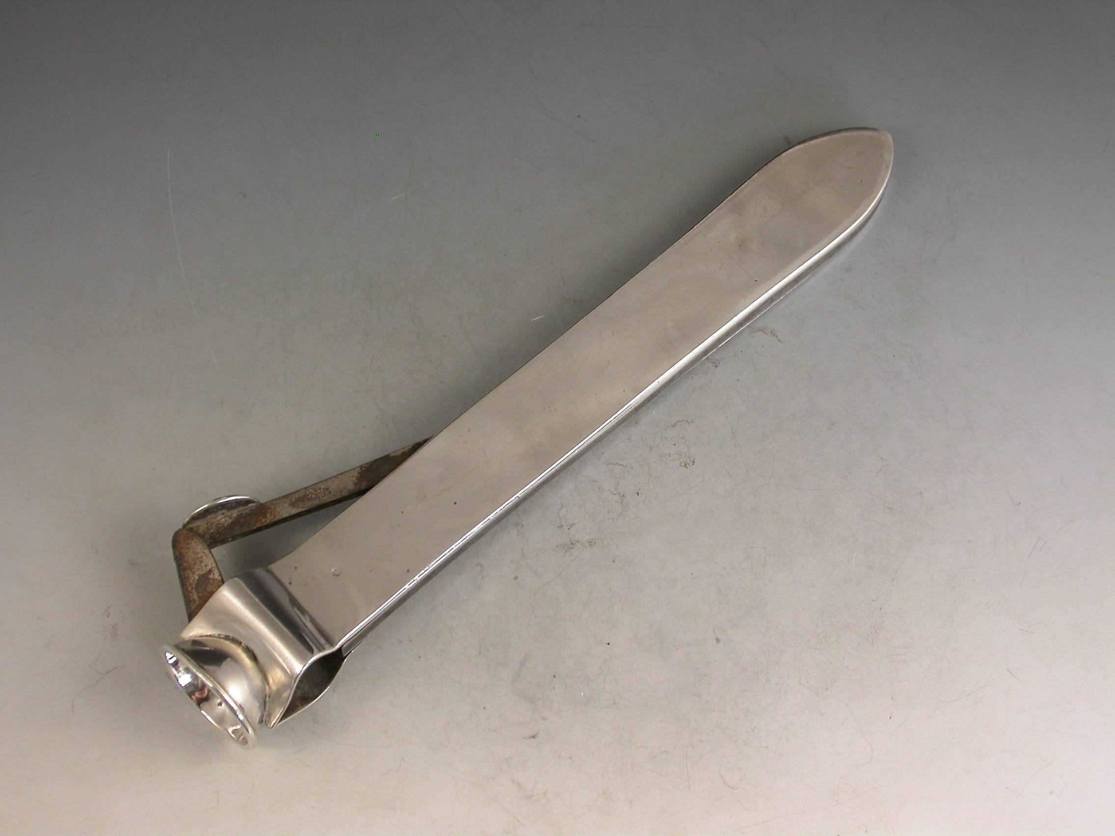 A large and heavy quality George V silver mounted steel Cigar Cutter with plain silver side plates incorporating a steel blade.

By J C Vickery, London, 1911

In good condition with no damage or repair.

Measures: Height 23 mm (0.91