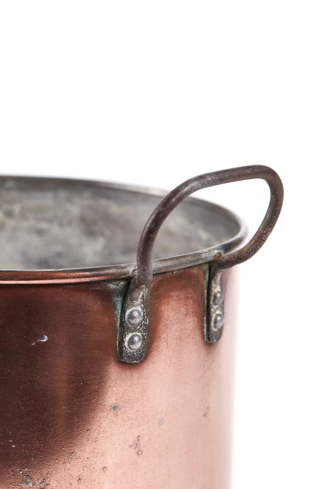 This is a large Georgian antique copper saucepan with a large iron handle, lovely antique condition.