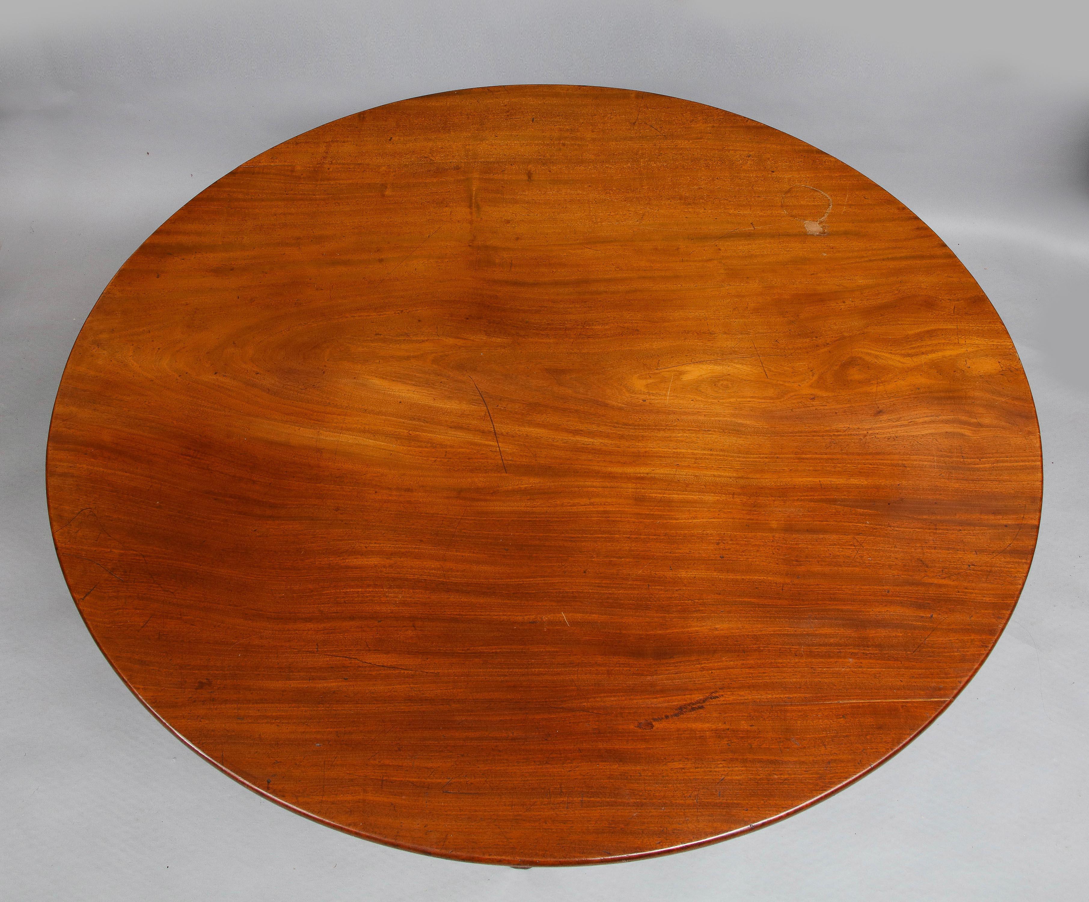 Very fine George III period breakfast table attributed to Thomas Chippendale, the slightly oval top with well matched timbers (appears to be one plank, but on very close inspection, is three) over balustrade turned shaft supported by three legs with
