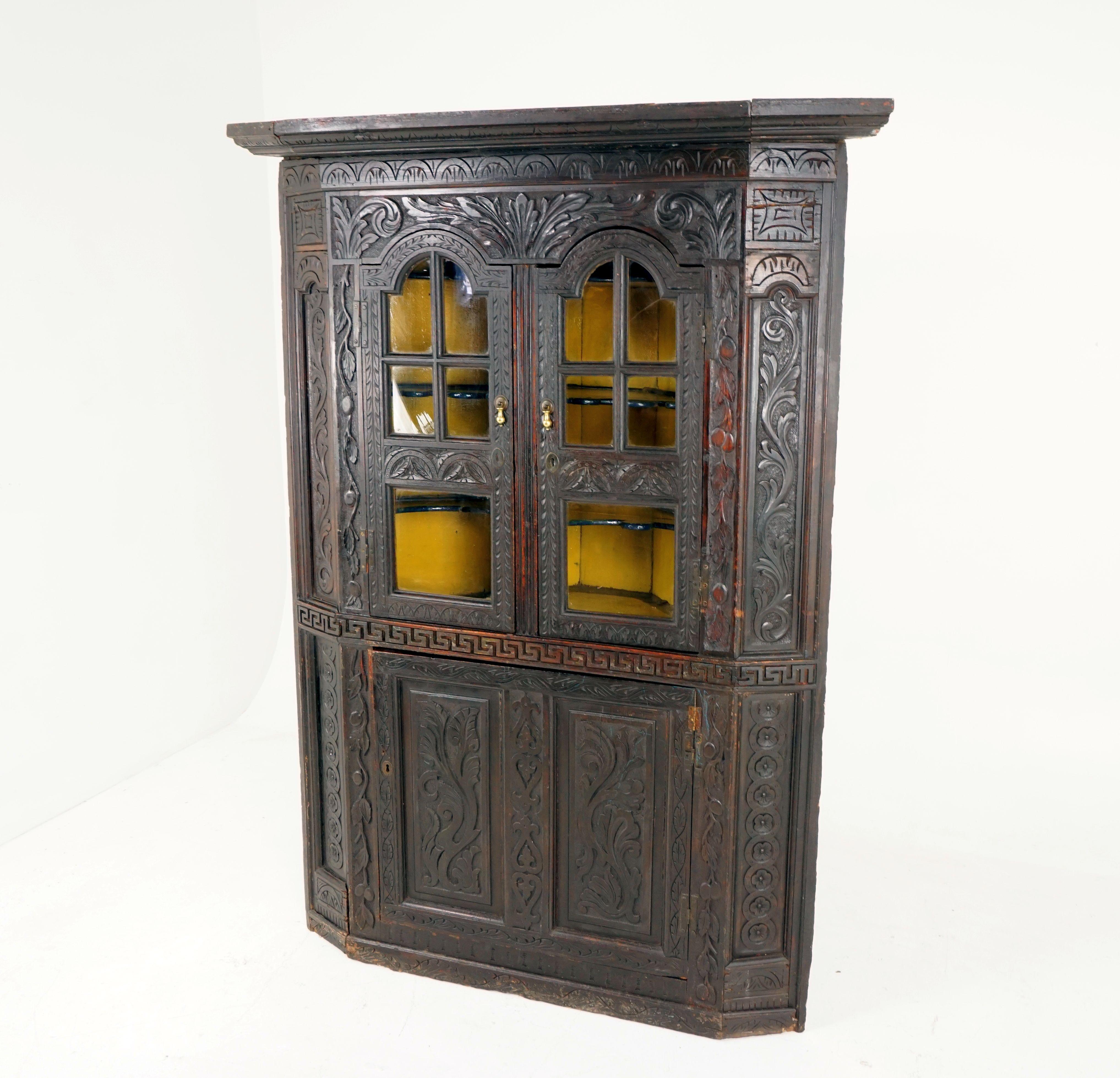 Large Georgian carved Gothic oak corner cabinet cupboard, Scotland, 1780, H127

Scotland 1780-1800
Solid oak
Original finish
Large protruding cornice on top
Carved frieze underneath
Pair of original carved glass doors
Opens to reveal three painted