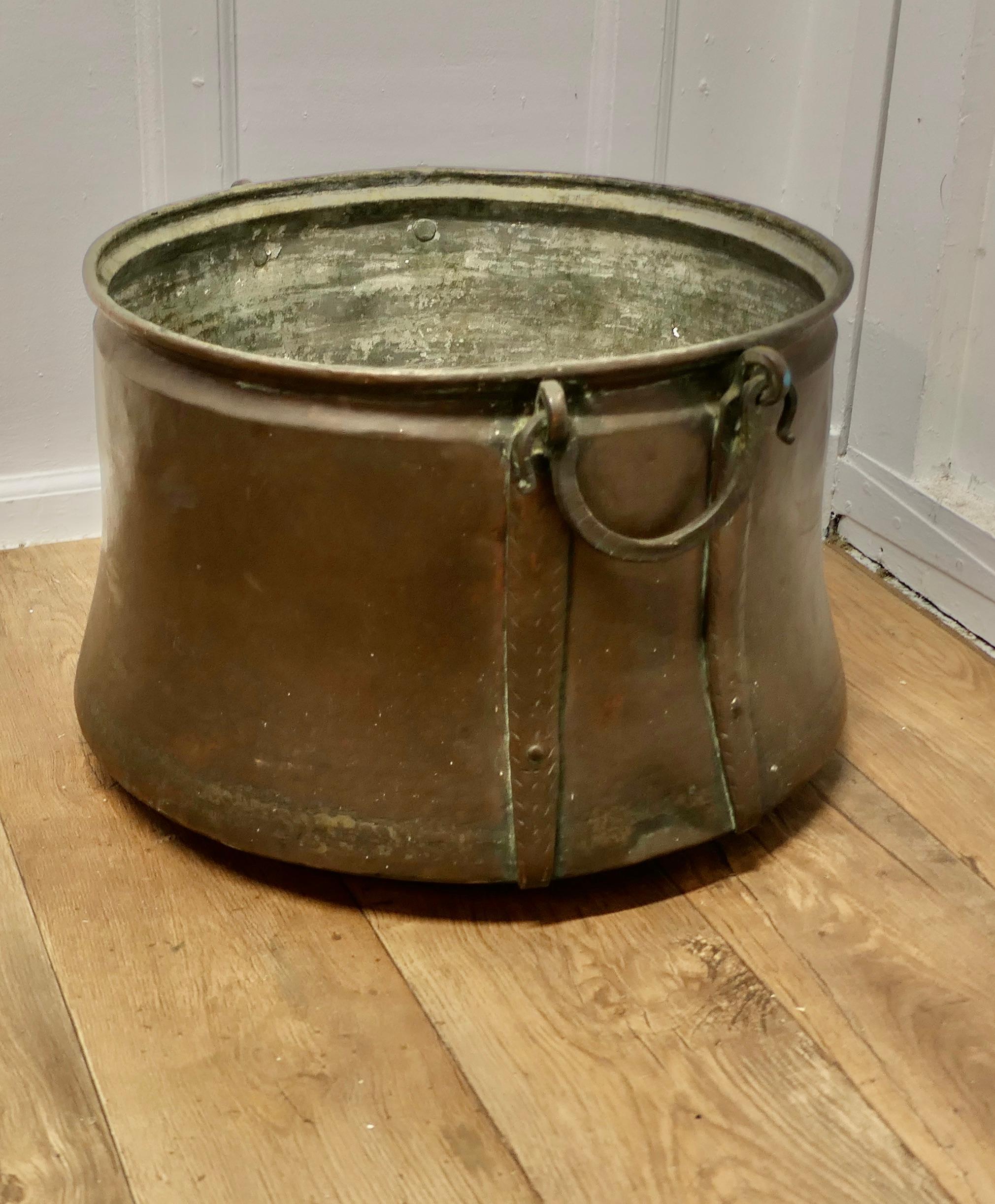 Large Georgian Copper Cauldron or Log Bin  

This is a lovely big copper Cauldron, this is a good big piece and would make a really good log container and handy because it has 2 carrying handles 

The cauldron is in very good well aged condition, it