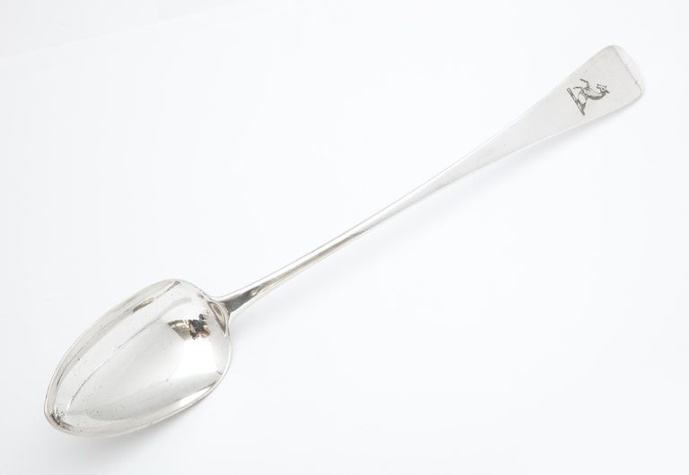 Large Georgian (George III) stuffing spoon having a deer armorial, London, year-hallmarked for 1807, John Blake - maker. Measures 12 inches long x 2 inches deep (at deepest point) x 1 1/2 inches high (at highest point when lying flat). Weighs 3.380