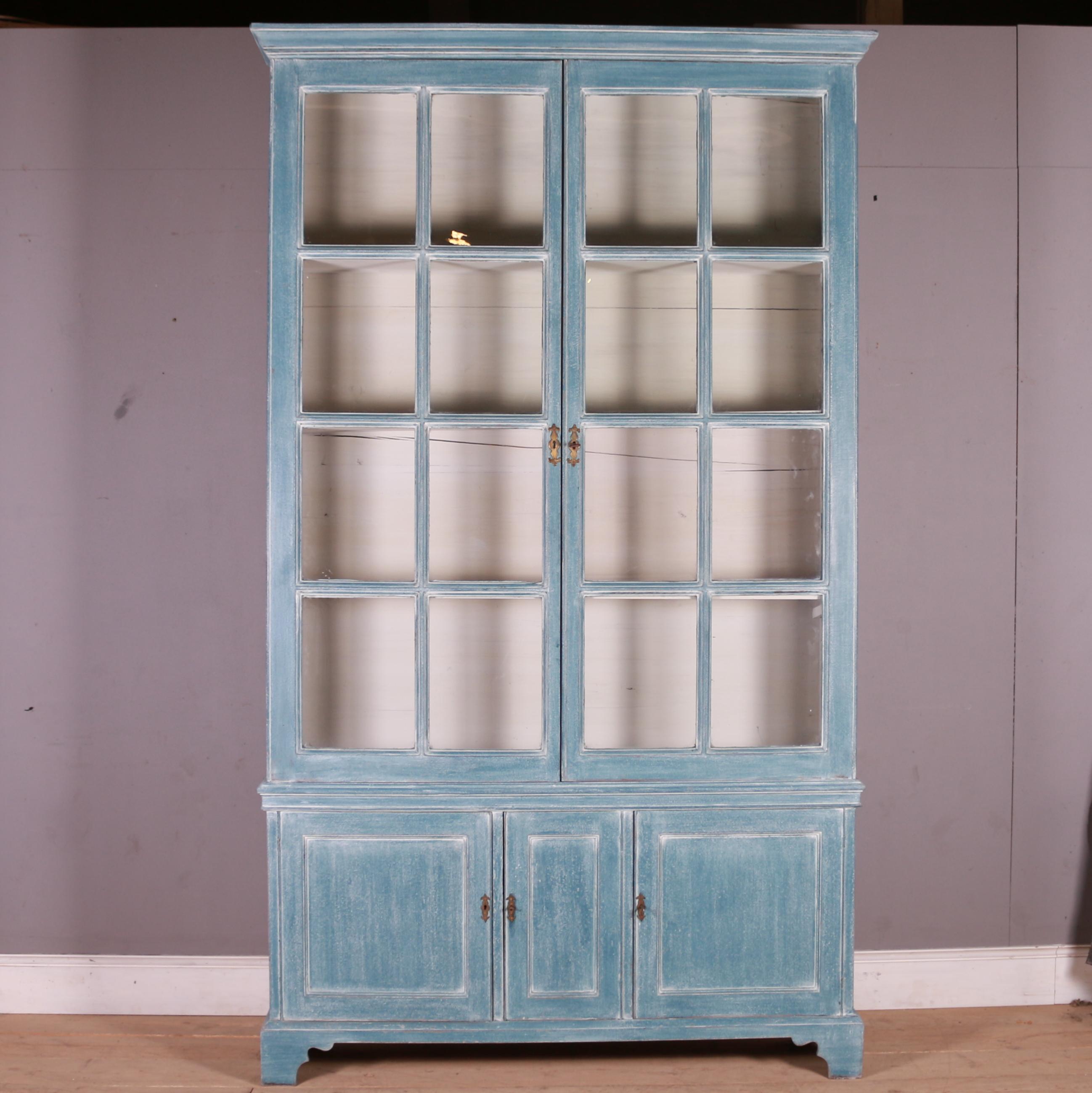 Large early 19th C English painted pine library bookcase with adjustable shelves. The bookcase comes with one extra shelf. Great bold design. 1820.

The top section does come off the base for transport and delivery

Shelf depth -