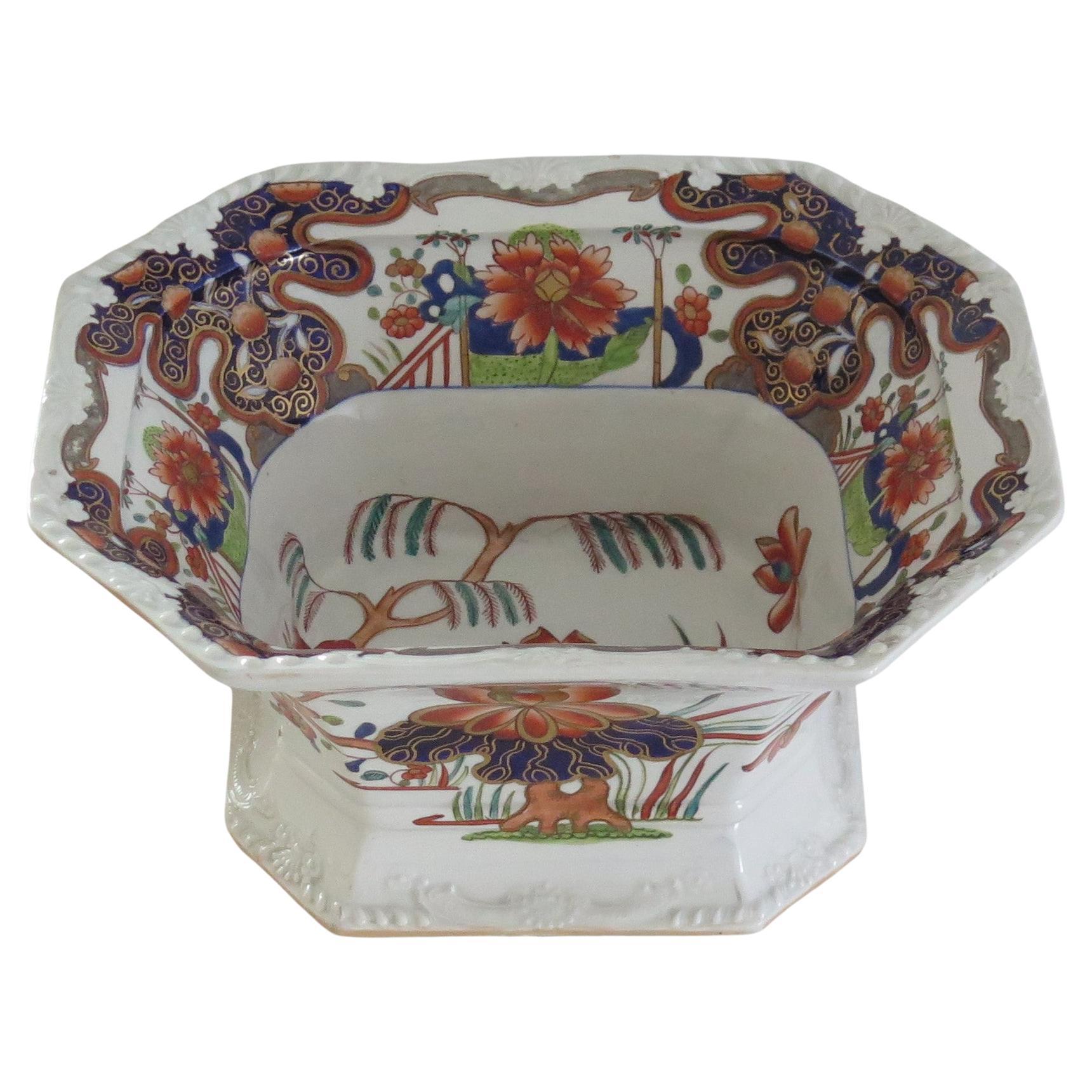 This is a beautifully hand painted large Serving Bowl in the rare Water Lily and Willow pattern by Mason's Ironstone, Lane Delph, England, dating to circa 1818.

The piece is well potted as a deep bowl on a raised foot or plinth. The top inner