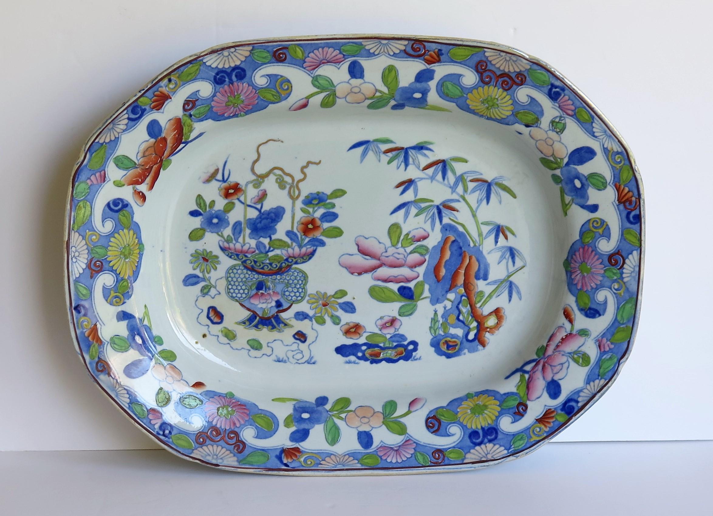 This a large, early 19th century serving dish of 14.5 inch width made by Mason's Ironstone in the Bamboo and Basket chinoiserie pattern, dating to the English Georgian period, Circa 1815.

Very early 19th century Mason's Ironstone Serving Dishes