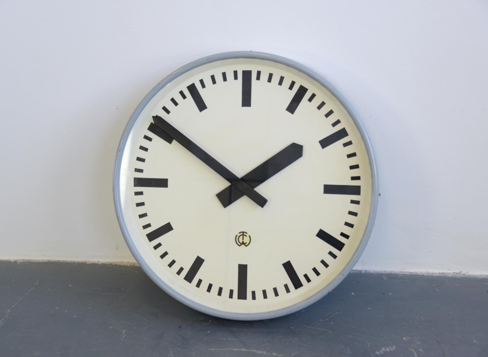 Large German factory clock, circa 1950s

- Steel casing and dial
- Glass face
- Original hands
- New high torque quartz motor
- AA battery powered
- German, 1950s
- Measures: 55cm x 55cm x 8cm 

Condition report

Fully restored and