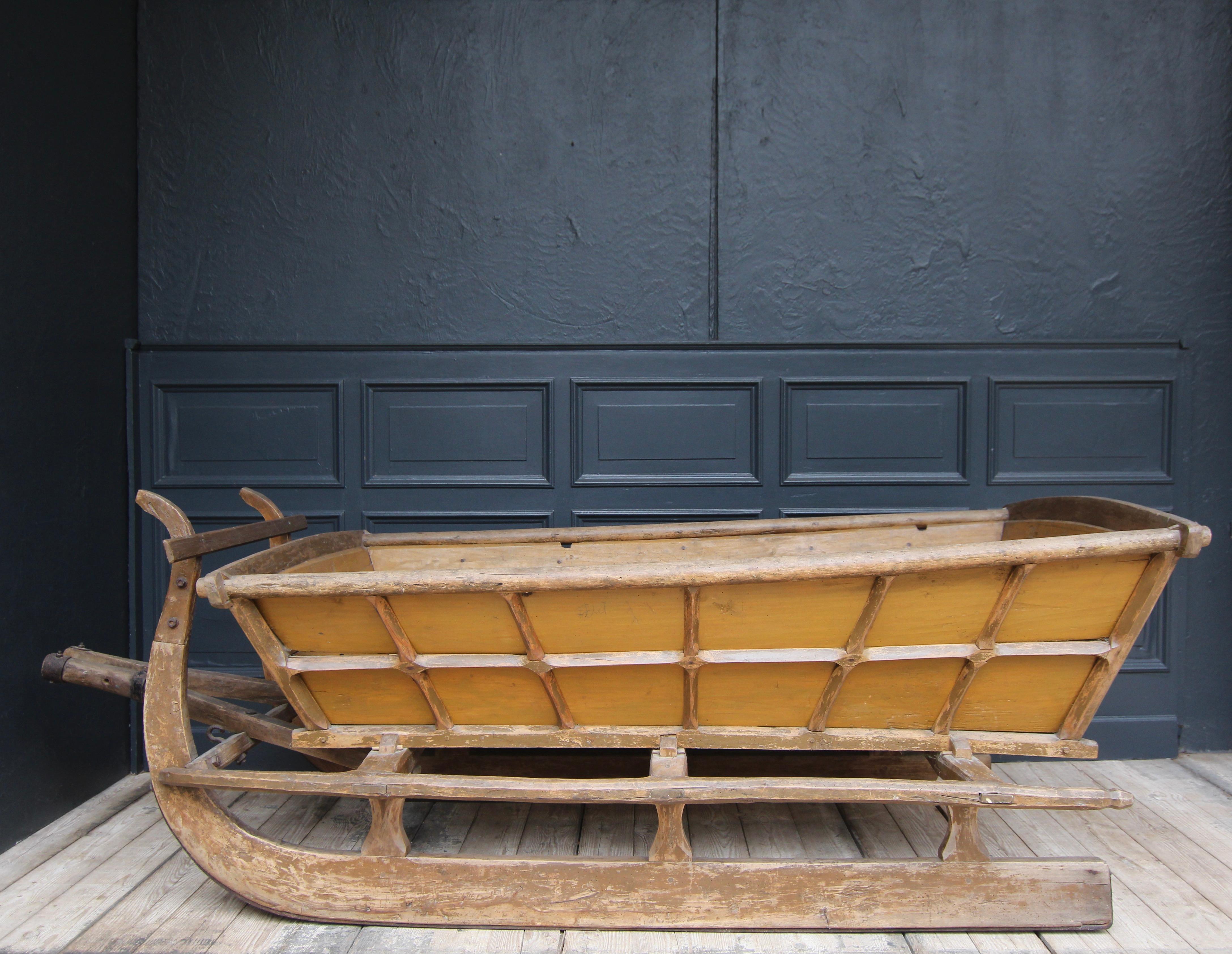 Large decorative german folk art horse-drawn sleigh from the late 19th century.

Dimensions: 
87 cm high / 34.25 inch high,
250 cm wide / 98.42 inch wide, 
106 cm deep / 41.73 inch deep.