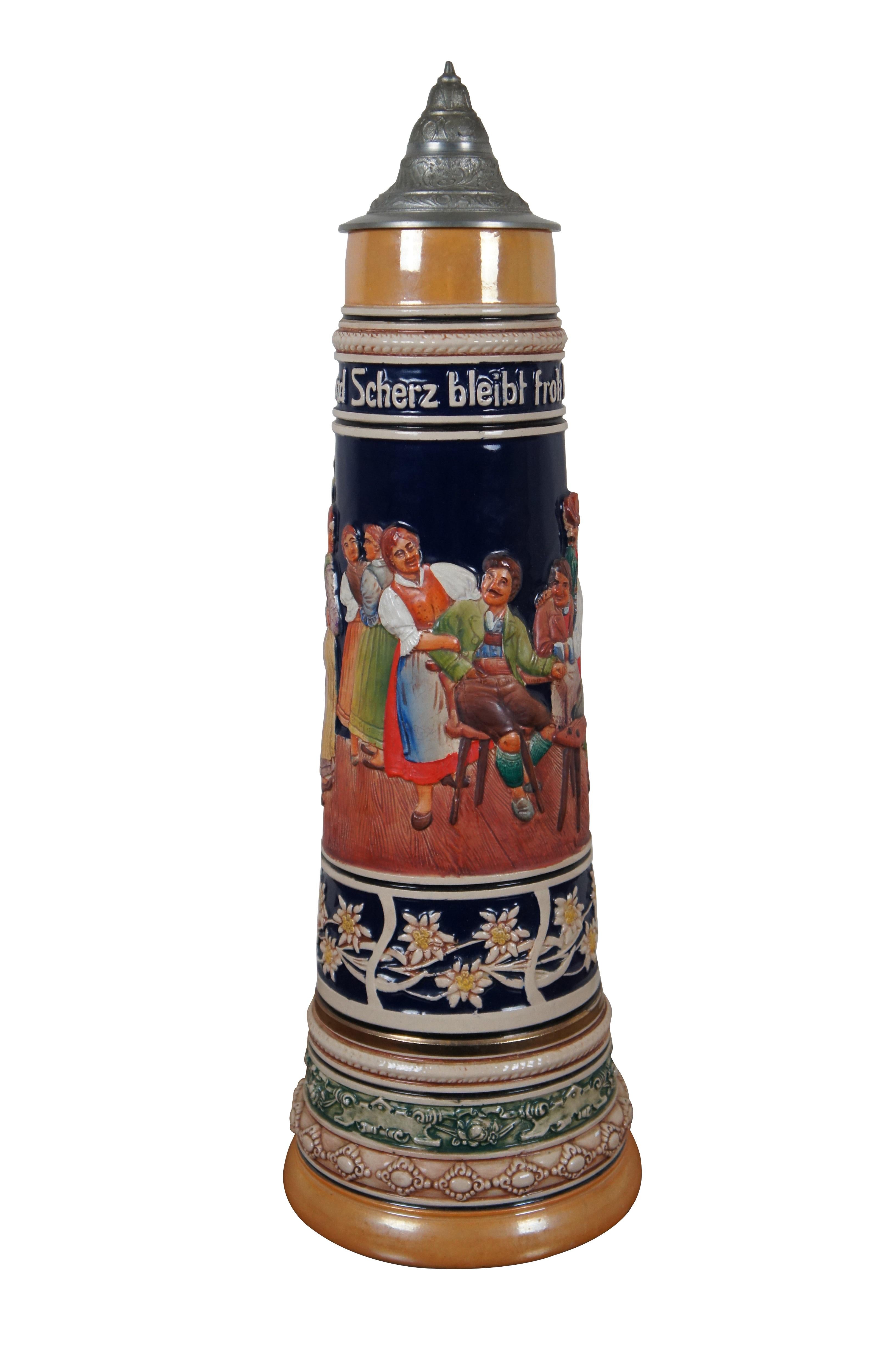 Very large mid 20th century 4 liter ceramic beer stein by Gerz. Decorated with a tavern scene, bands of floral patterned motifs, and twisted branch handle. Band around the top reads 