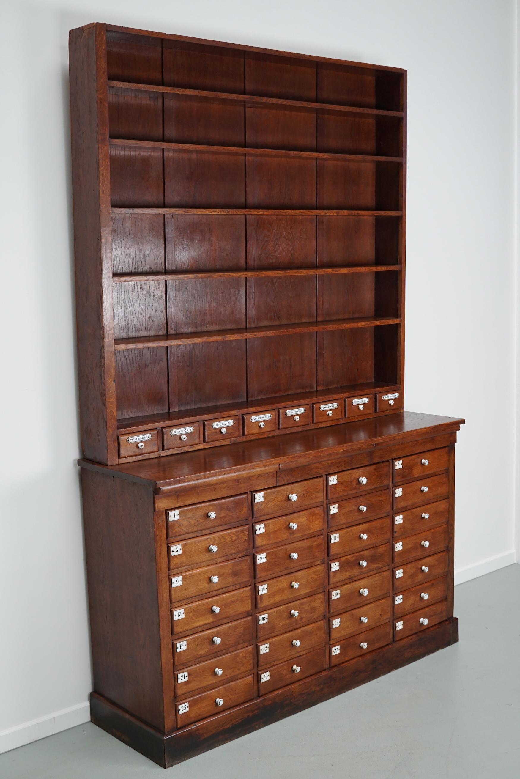 Large German Oak Apothecary Cabinet with Enamel Shields, Late 19th Century In Good Condition In Nijmegen, NL