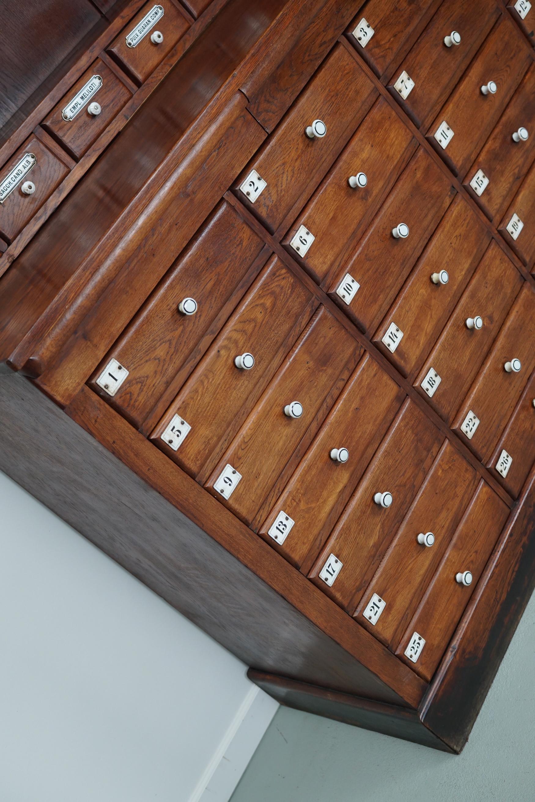 Large German Oak Apothecary Cabinet with Enamel Shields, Late 19th Century 1