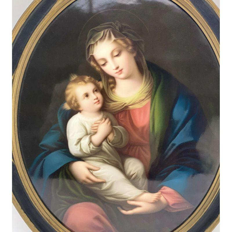 Large German painted porcelain plaque of madonna & child, 19th century.

The large oval plaque is possibly artist signed by 