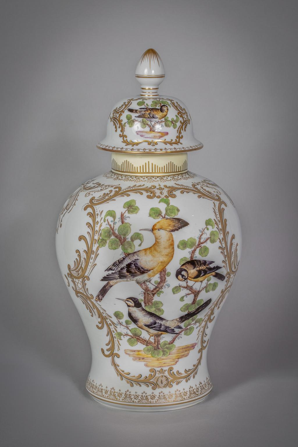 Painted on either side with birds on panels, the cover similarly decorated. With a 19th century Hochst underglaze blue mark.
