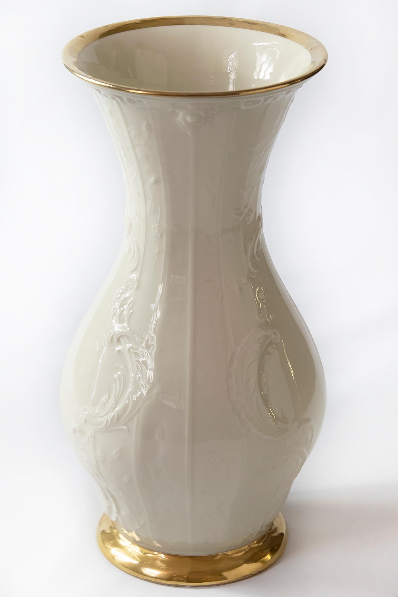 Large ivory porcelain vase Sanssouci by German porcelain Rosenthal.
The glossy ivory ceramic vase decorated with classical pattern, gold line on the bottom and top.
Rosenthal mark on the bottom.
  