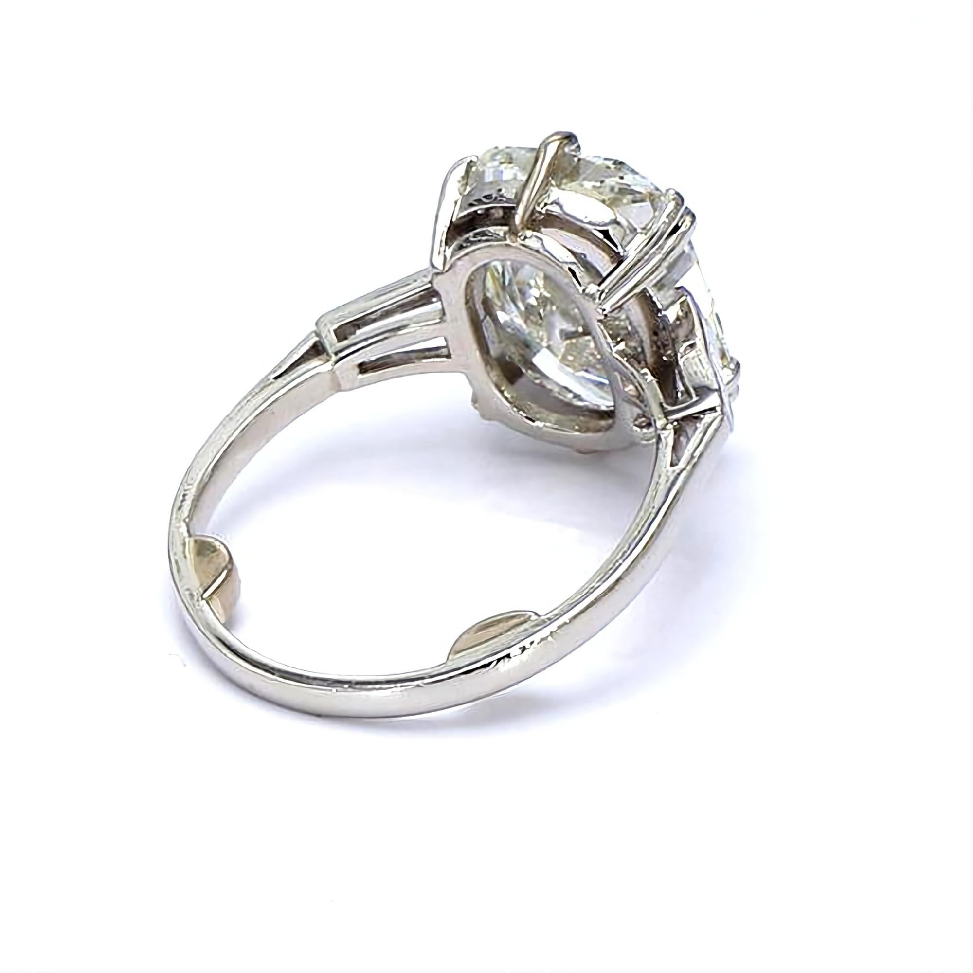 This Late Art Deco Huge GIA 5.04ctw Cushion Cut 3 Stone Diamond Platinum Vintage Ring is breathtaking! 
There is nothing more ELEGANT than Three Stone Diamond ring. Buy her this impressive and the most classic, timeless diamond ring which will go