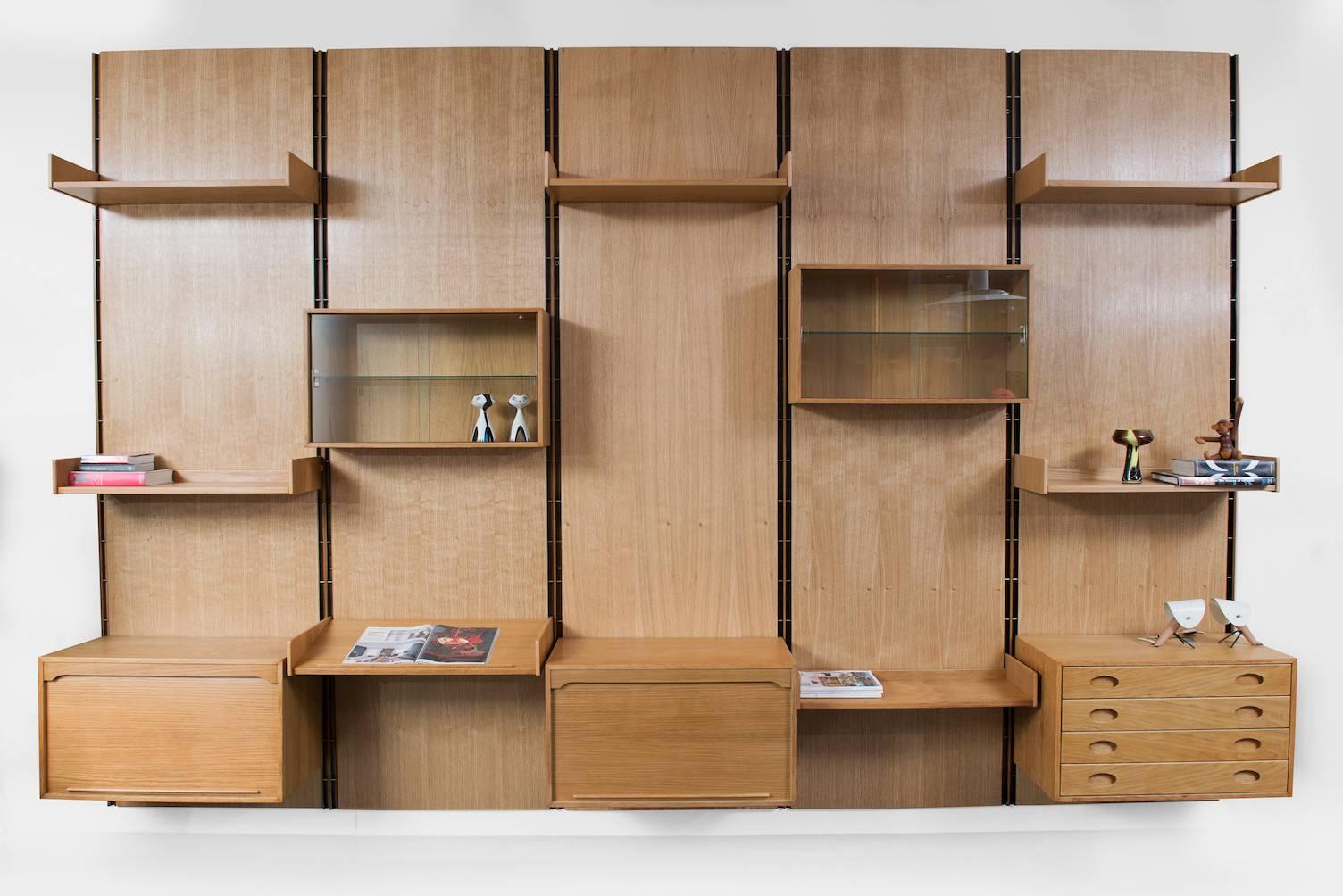 Oak free standing wall unit bookcase, the shelves and cabinets can be placed in many different ways.