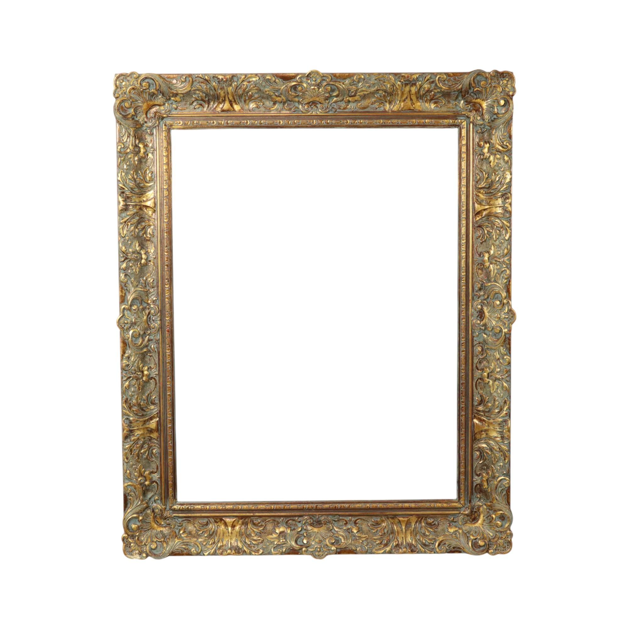 This large, impressively sized, gilded vintage pine frame boasts a distinctive and unique patina of age. It's XL in size, entirely in classic Baroque style, decorated with elegant acanthus leaves and patterns, circa the first half of the 20th