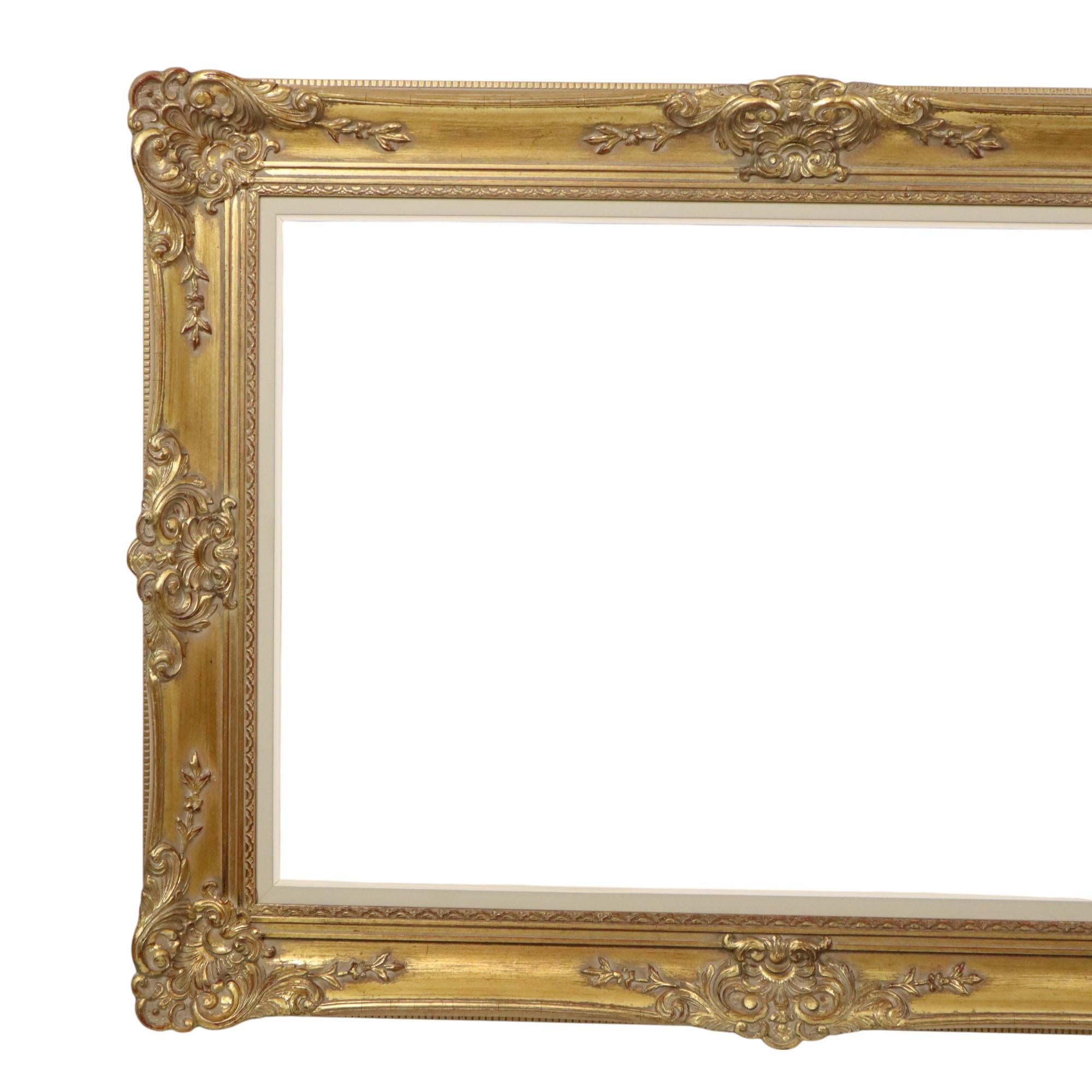 Large, gilded vintage pine frame with a distinctive patina of age, XL size, entirely in classic Baroque style, decorated with elegant acanthus leaves, patterns, and flowers, circa the first half of the 20th century.

A lovely size frame for creative