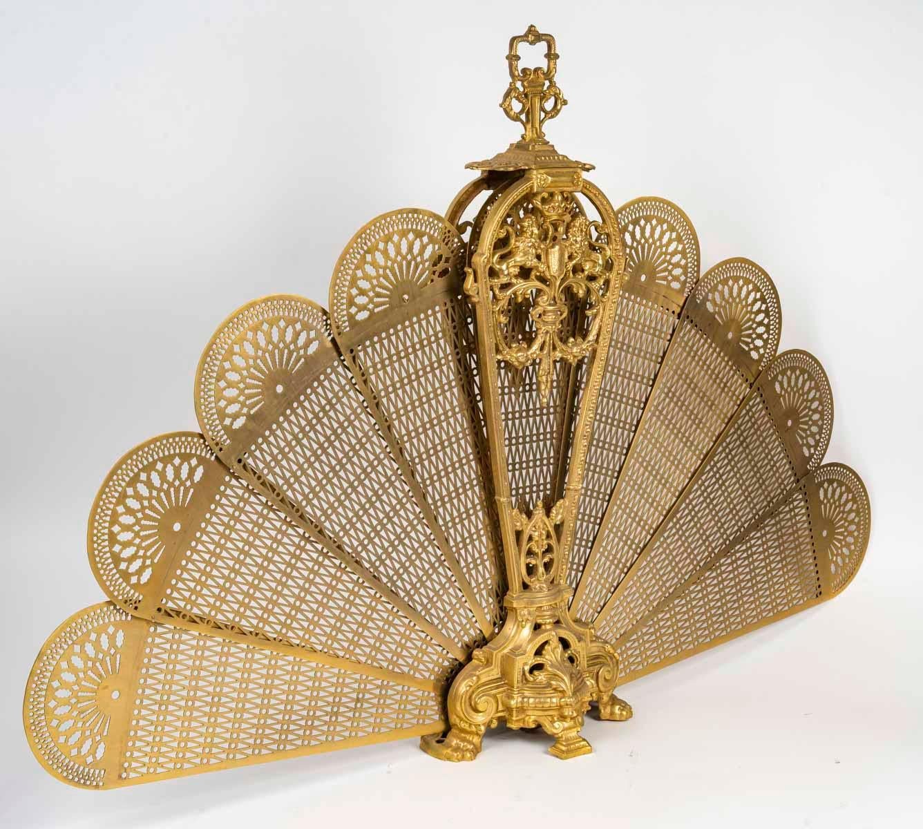 Large gilded bronze fan-shaped fire screen in the Louis XVI style.

A very fine quality Napoleon III period Louis XVI style fan-shaped fire screen in chased ormolu.
Height 85cm. W: 115cm, D: 22cm