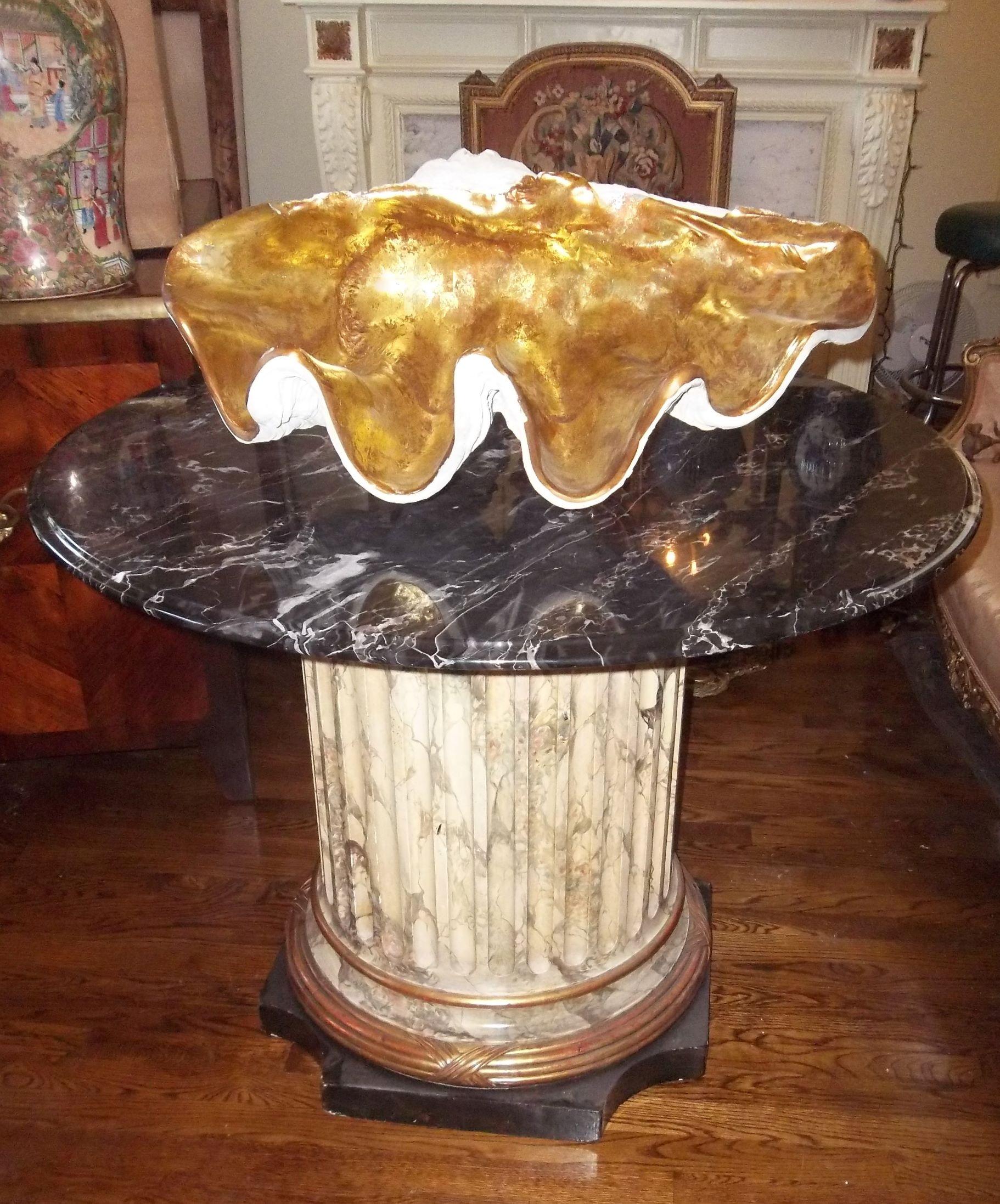 Probably mid-20th century, composite material, probably spun fiberglass (a popular medium of the era, durable and lightweight). Realistically cast and the inside gilded. A jardiniere, a table centerpiece, something for in front of the hearth in off