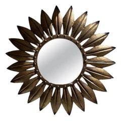 Espejo grande de hojas de hierro dorado