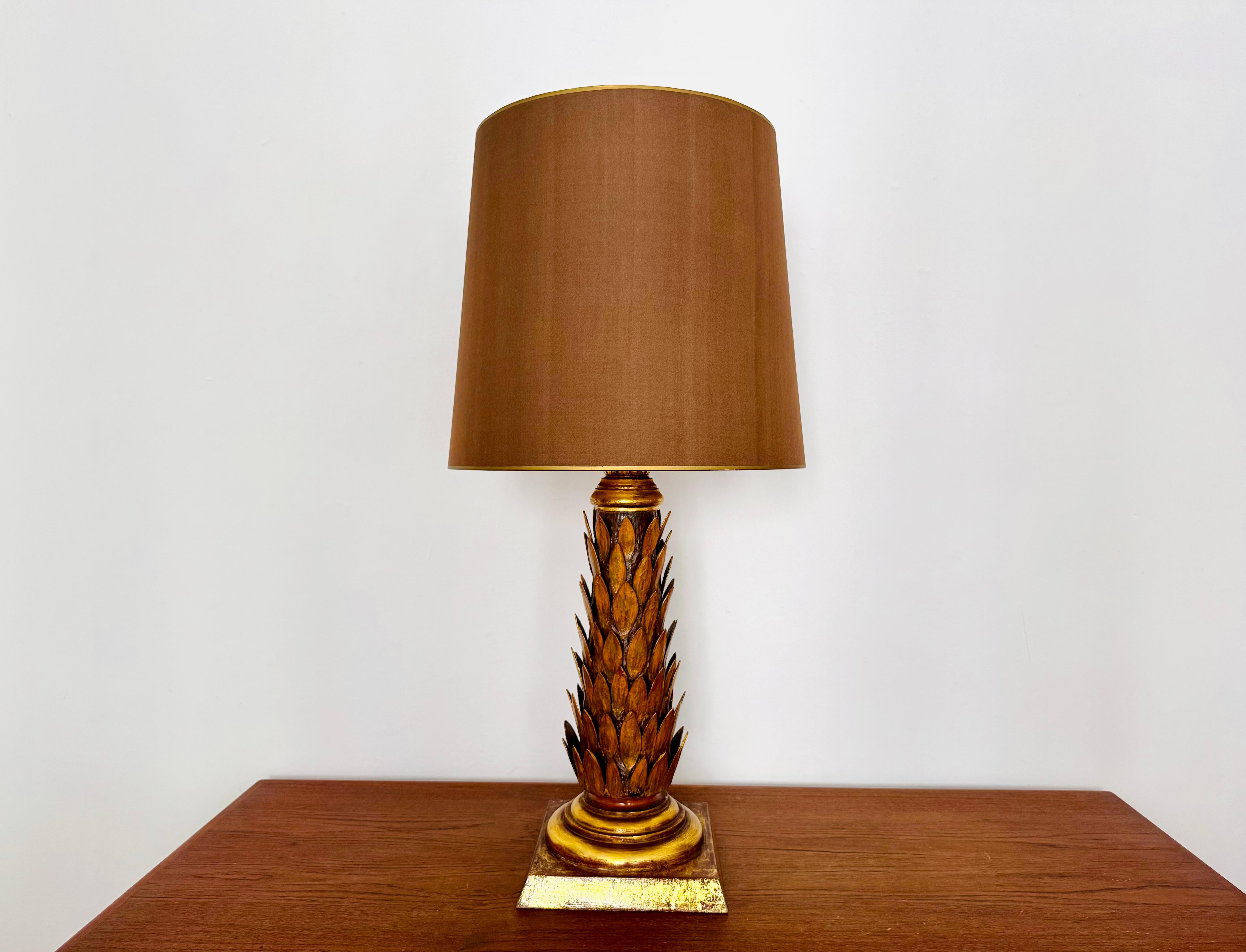 Very beautiful and large gold-plated table lamp from the 1970s.
Great design and high-quality workmanship.
It creates a wonderful light.

Condition:

Very good vintage condition with slight signs of age-related wear.
Some patina and minimal loss of