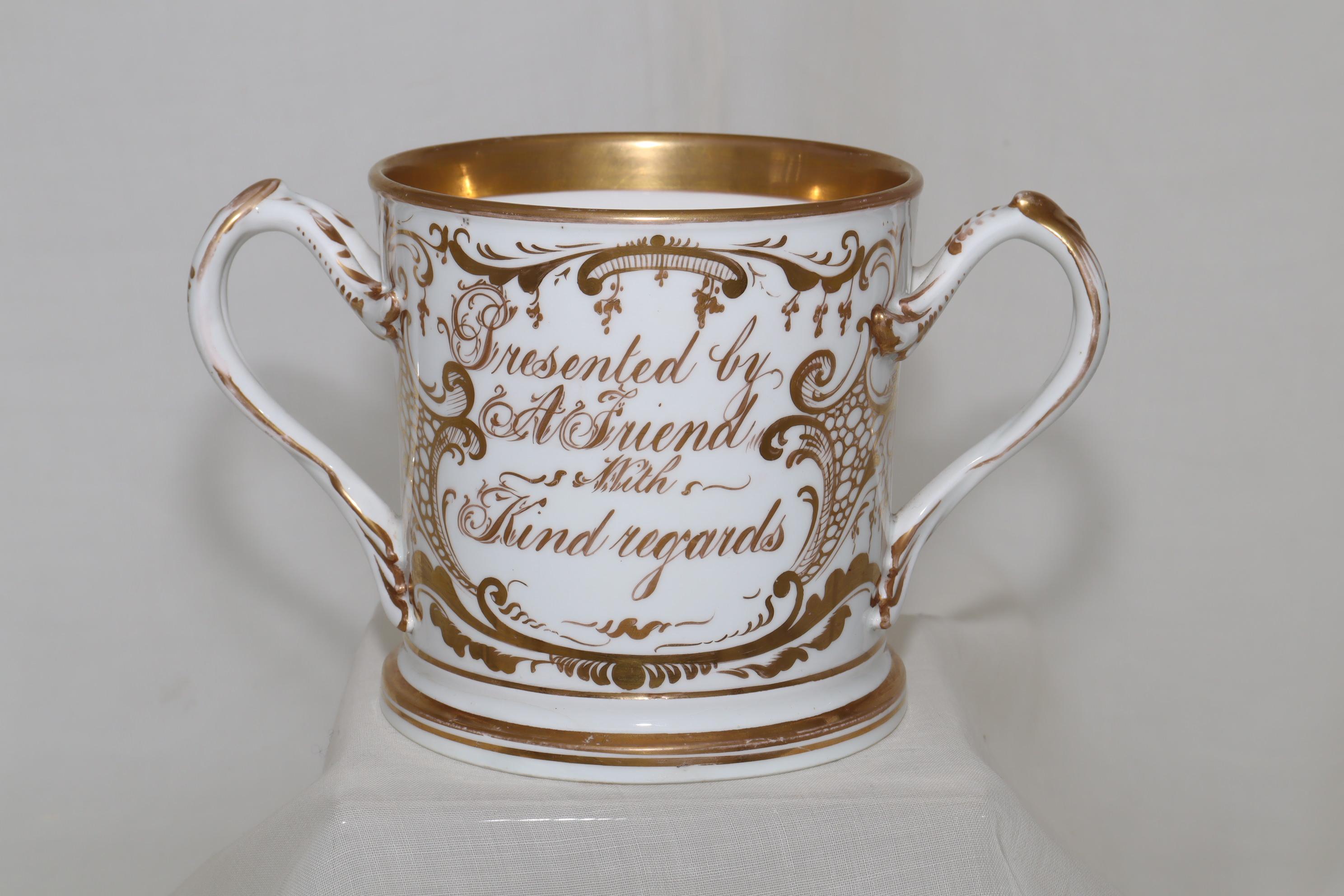 This large, superbly gilded loving cup, carries on one side, the inscription 