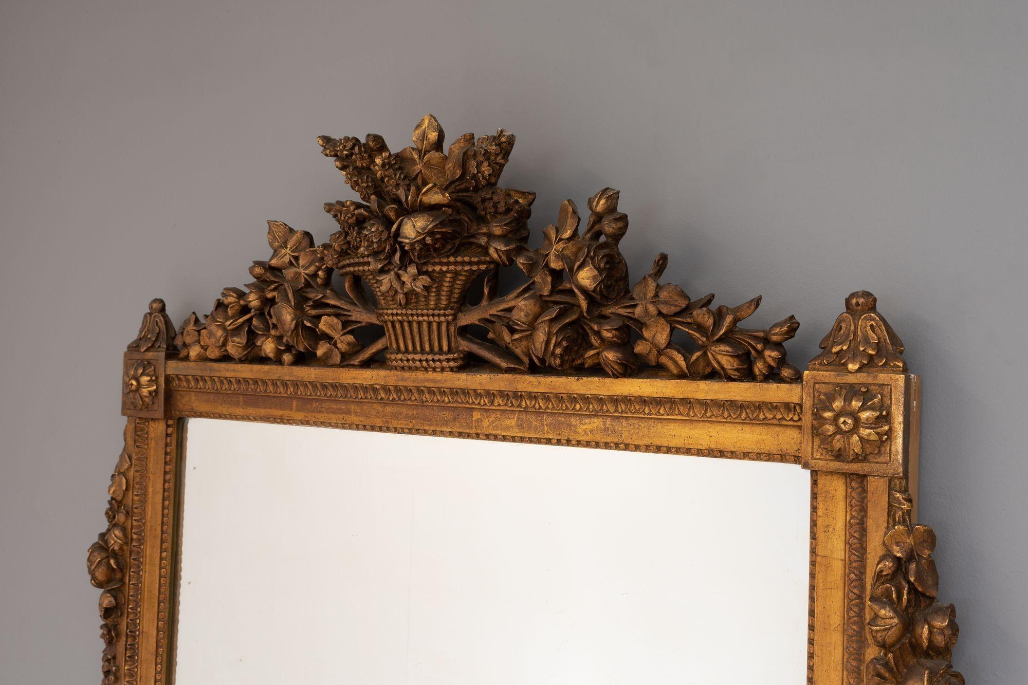 Large gilded French mirror with original plate. Circa 1930.