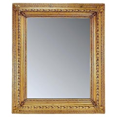 Large gilded wood and stucco mirror with foliage - 20th