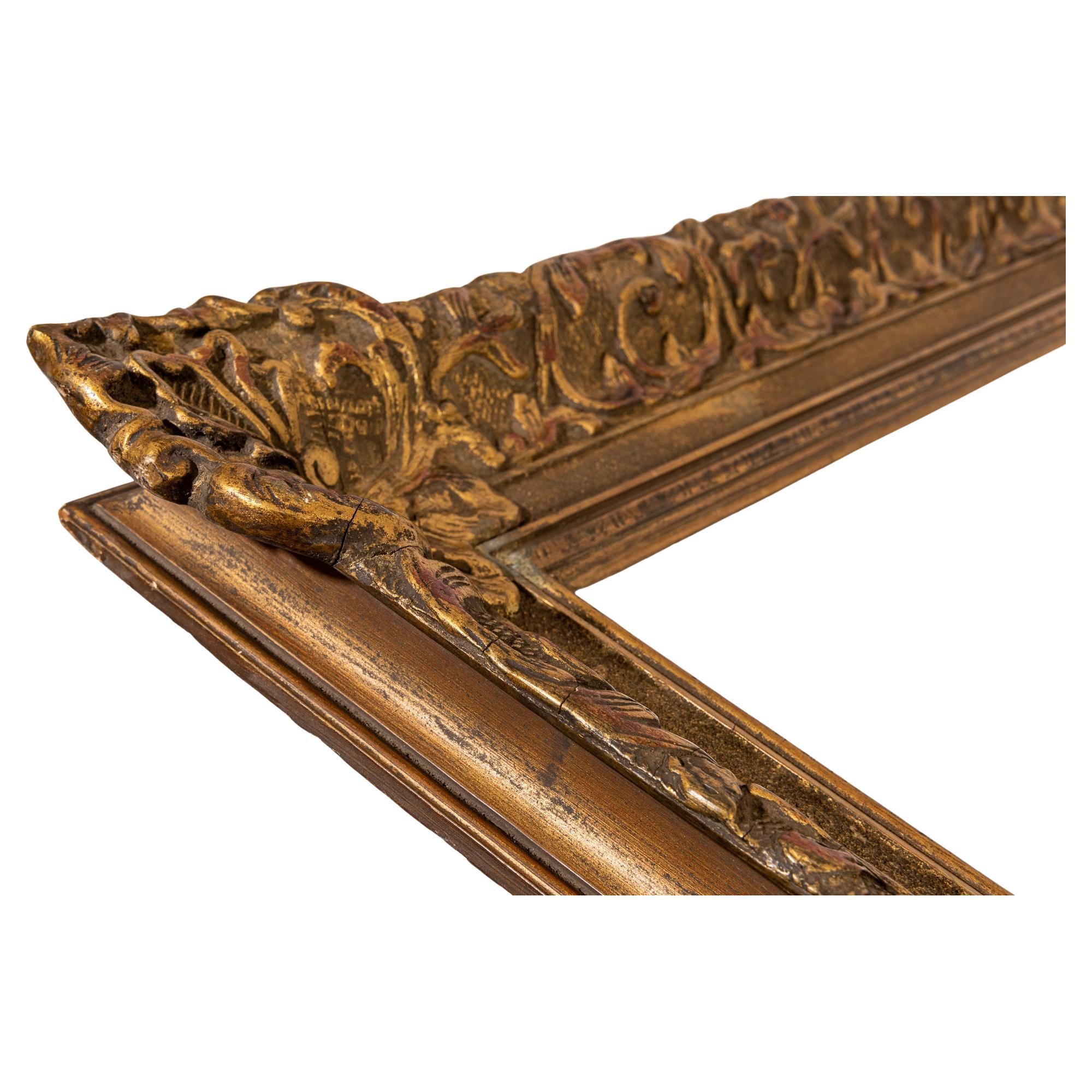 Hand-Crafted Large Gilded Wooden Antique Frame For Sale