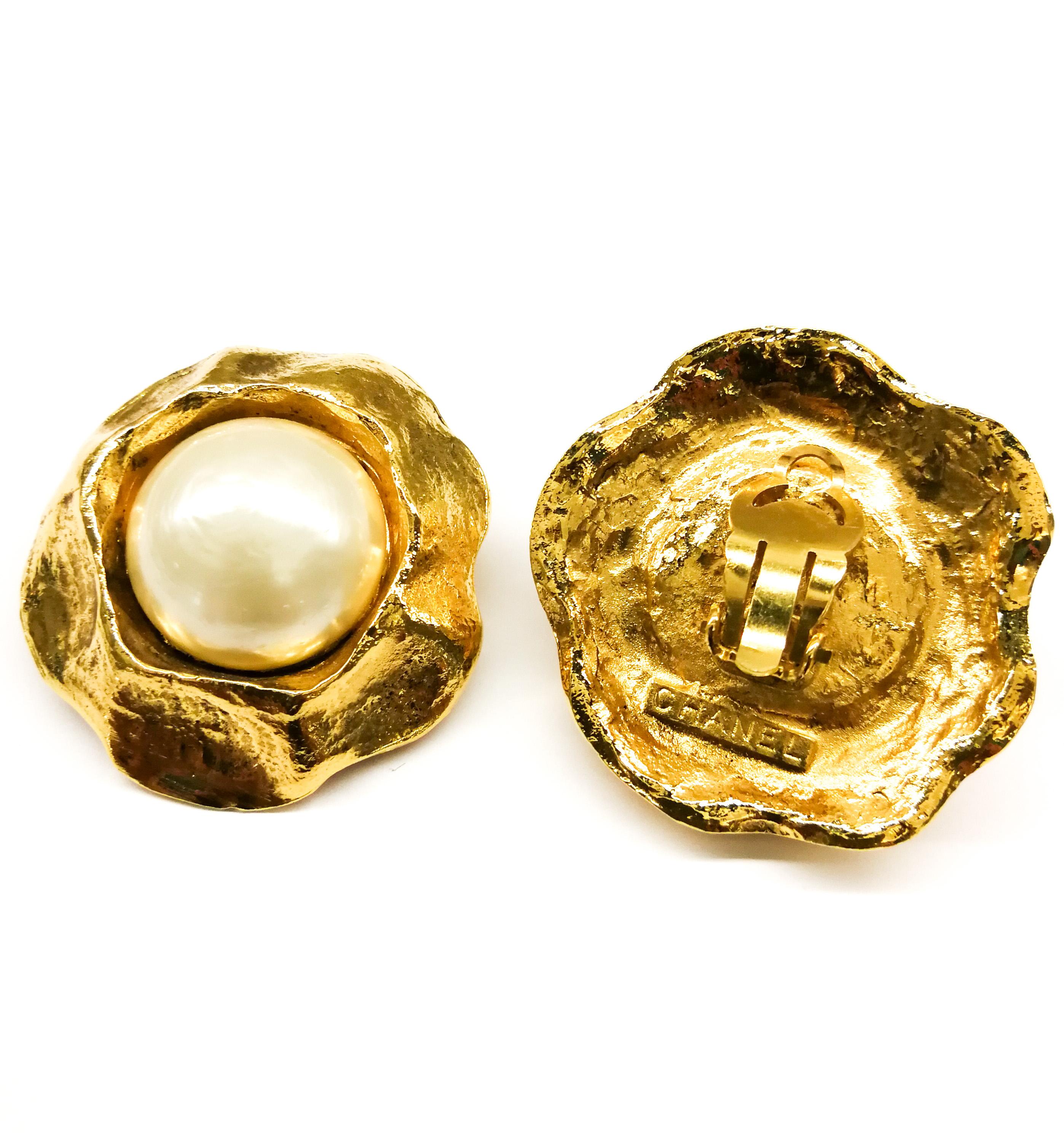 Classic pearl and gilt earrings , designed by Victoire de Castellane for Chanel, with a wide gilt 'thumb indented' border, in which is nestled a larger baroque pearl cabuchon. Very smart, a prime example of Castellane's oeuvre at Chanel at this time