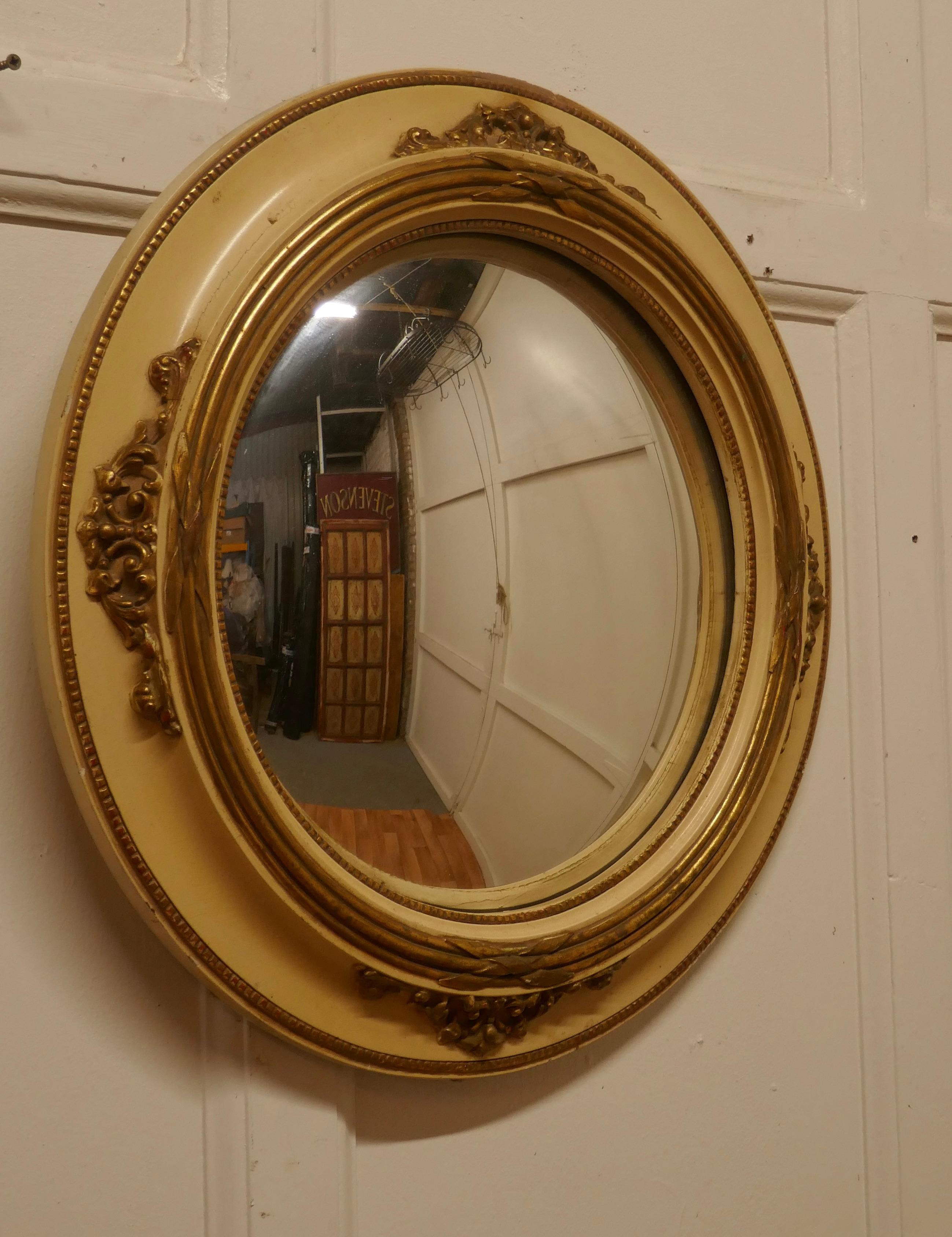 Large gilt and cream French convex wall mirror 


This is a very attractive Mirror has a 3.5” wide cream coloured and Gilt Gesso frame and has a convex looking glass 
The mirror is in good condition as is the original convex looking glass

The