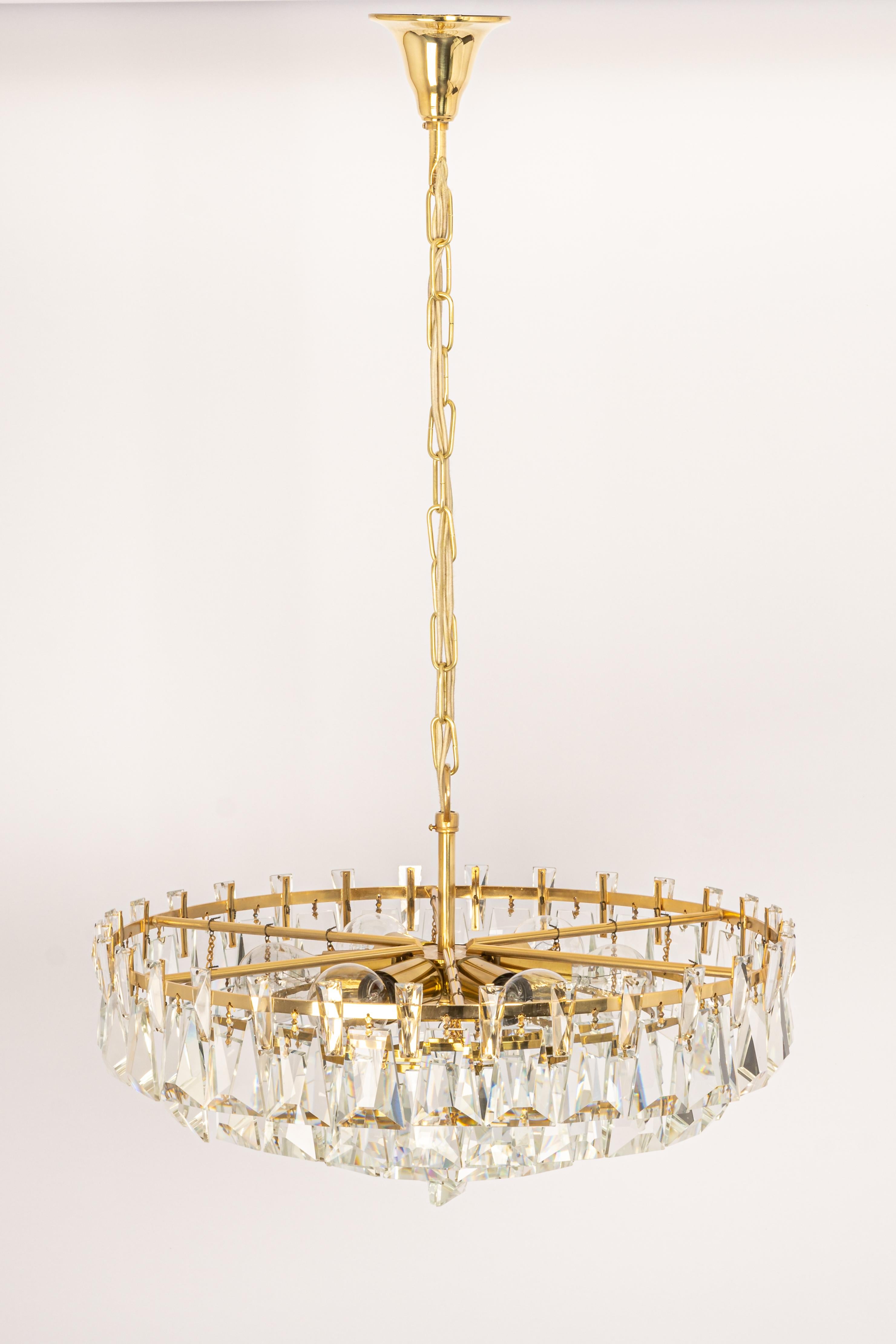 A wonderful and high-quality gilded chandelier or pendant light fixture by Palwa, Germany, 1970s.

It is made of a brass frame decorated with individual 