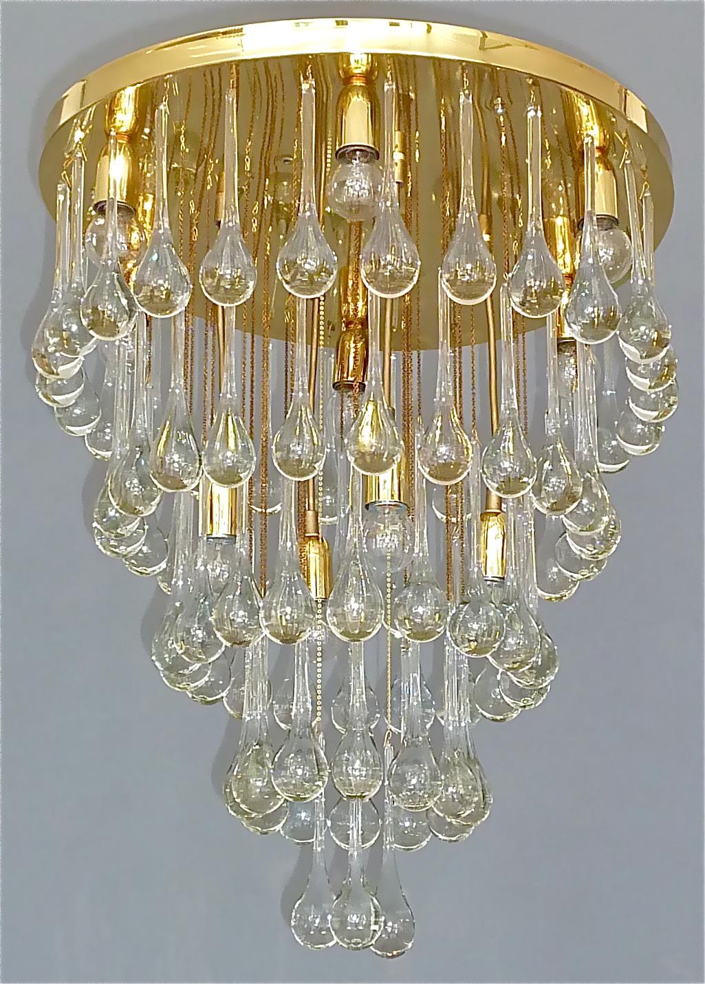 Stunning large gilt brass and clear Murano glass drop flush mount chandelier in Palwa or Venini style, Germany or Italy circa 1960s. This beauty has 5 tiers with handcrafted and mouth blown Murano crystal glass drops arranged like a waterfall and