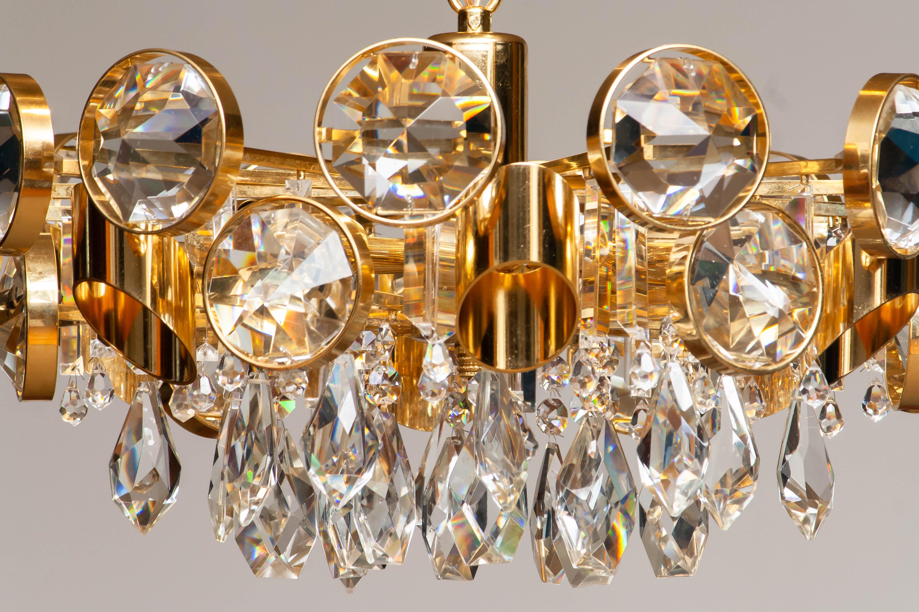 Grand lustre en laiton doré rempli de grands cristaux facettés par Ernest Palme en vente 2