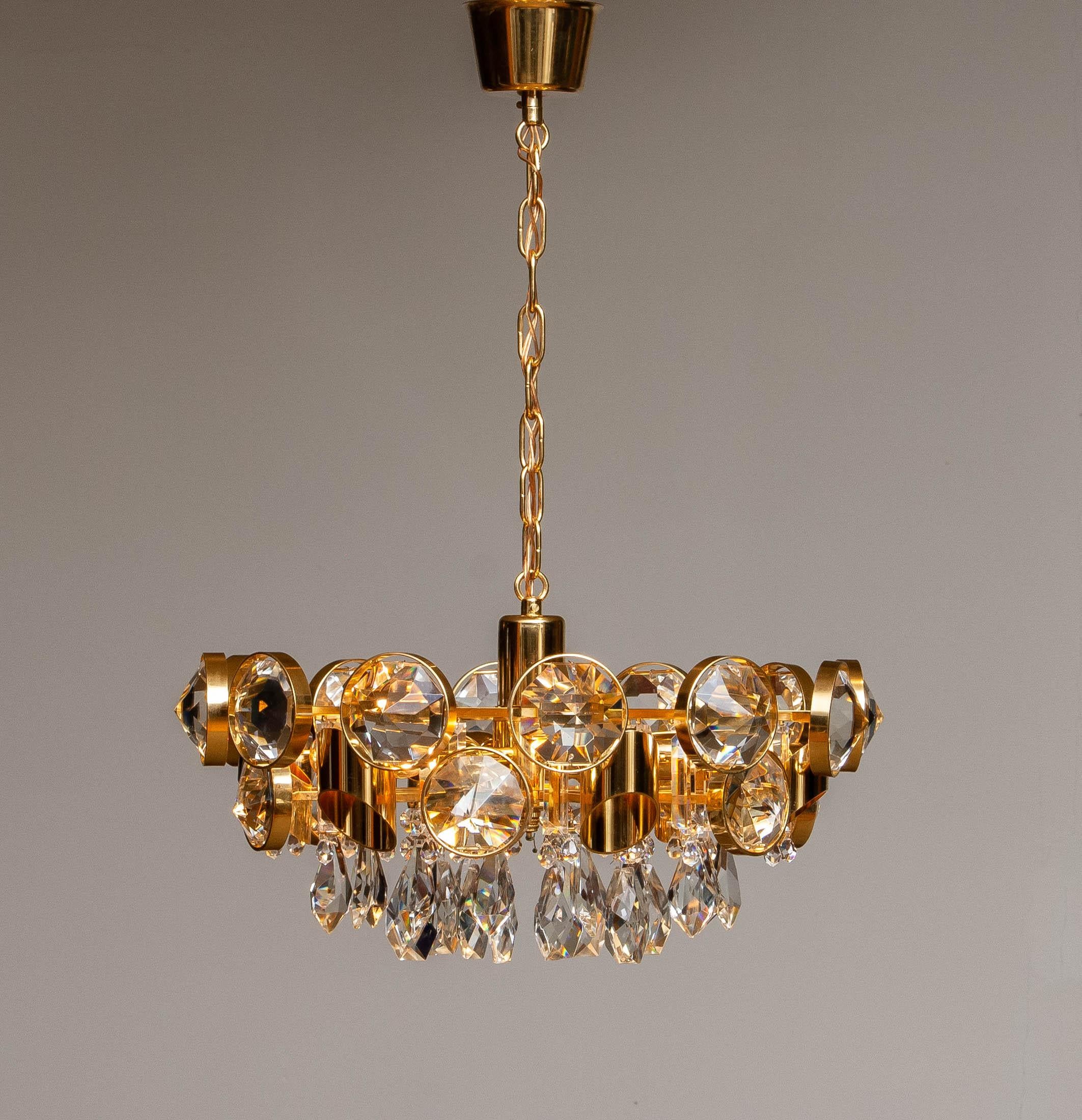 Mid-20th Century Large Gilt Brass Filled with Large Faceted Crystals Chandelier by Ernest Palme For Sale