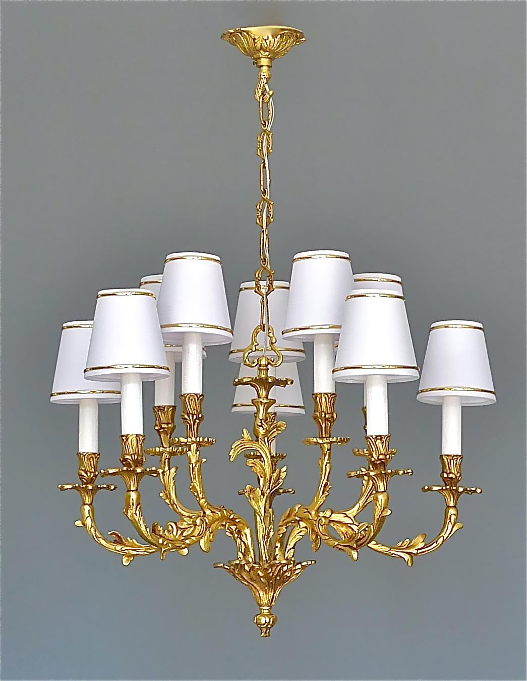 Amazing French Baroque Rococo style ten-light chandelier which can be dated to the second half of the 20th century and most possibly made by Maison Baguès, Paris in France. The wonderful manufactured chandelier is made of gilt bronze with new added