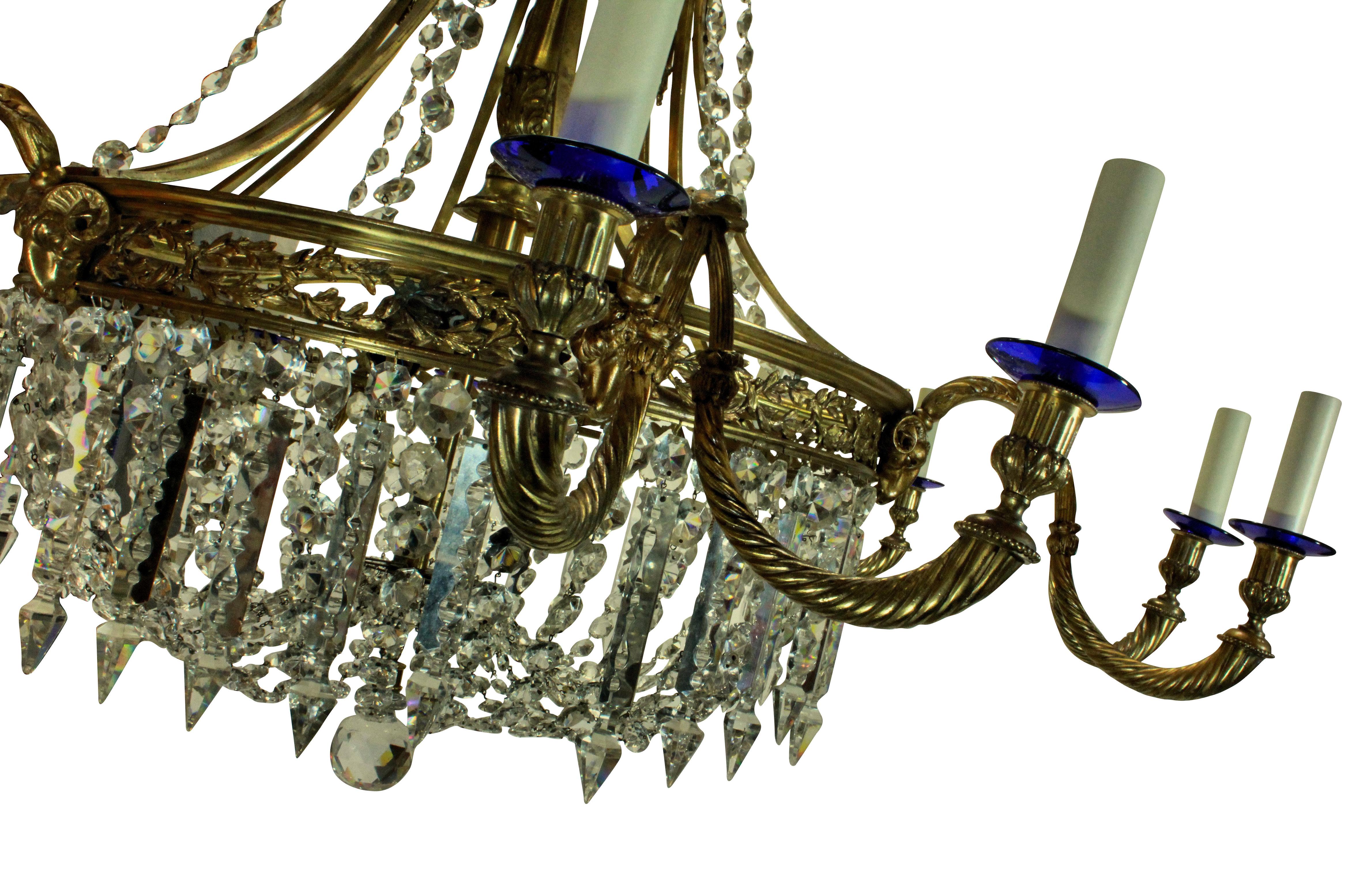 A large English Regency style gilt bronze and cut glass chandelier of fine quality. Formerly from Salperton Park, Gloucestershire.