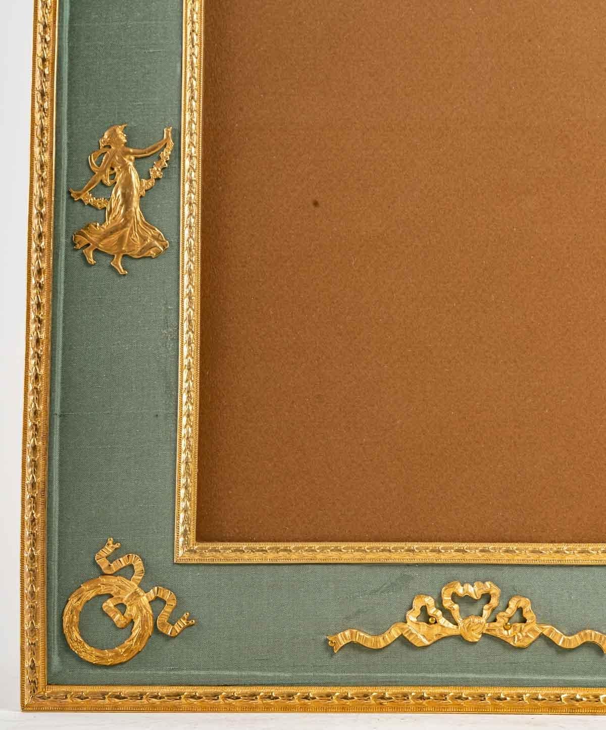 European Large gilt bronze and pale green fabric photo frame, 19th century