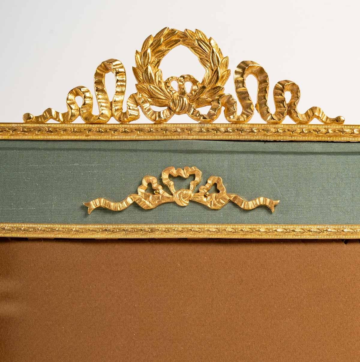 Gilt Large gilt bronze and pale green fabric photo frame, 19th century