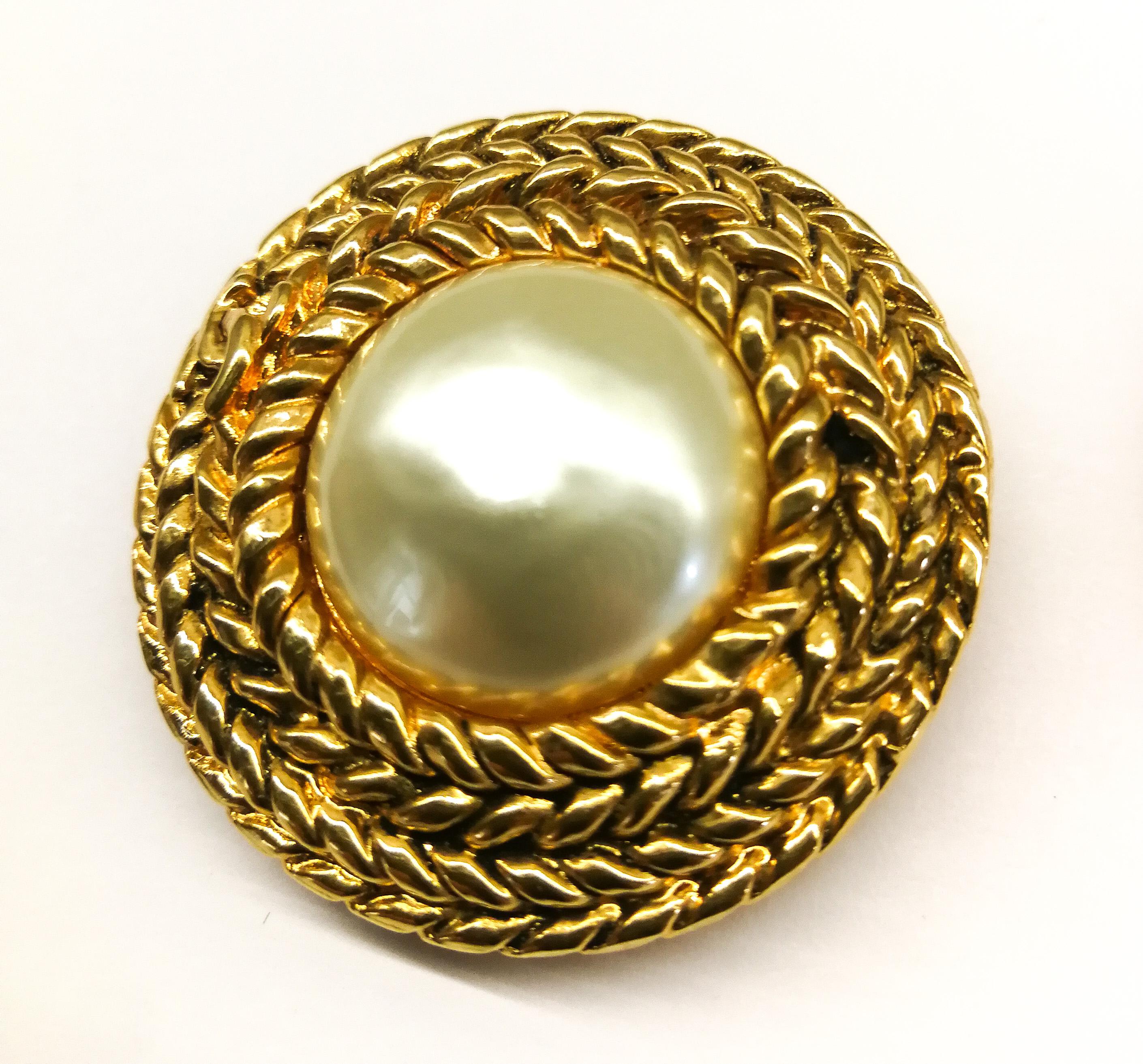 Classic pearl and gilt earrings , designed by Victoire de Castellane for Chanel, with a plaited gilt braid encircling the baroque pearl, with the iconic 'CC' motif interwoven. Smart, timeless and ulitmately wearable!
Not much needs to be said about