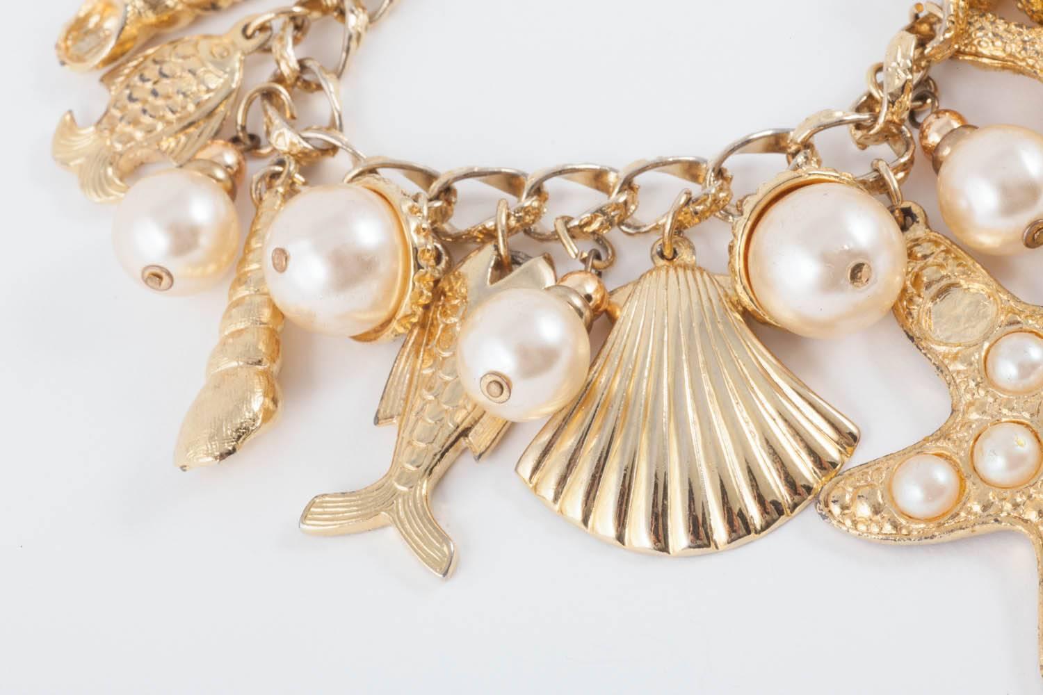 Large gilt metal and paste pearl 'seashell' charm bracelet, USA, 1960s In Excellent Condition In Greyabbey, County Down